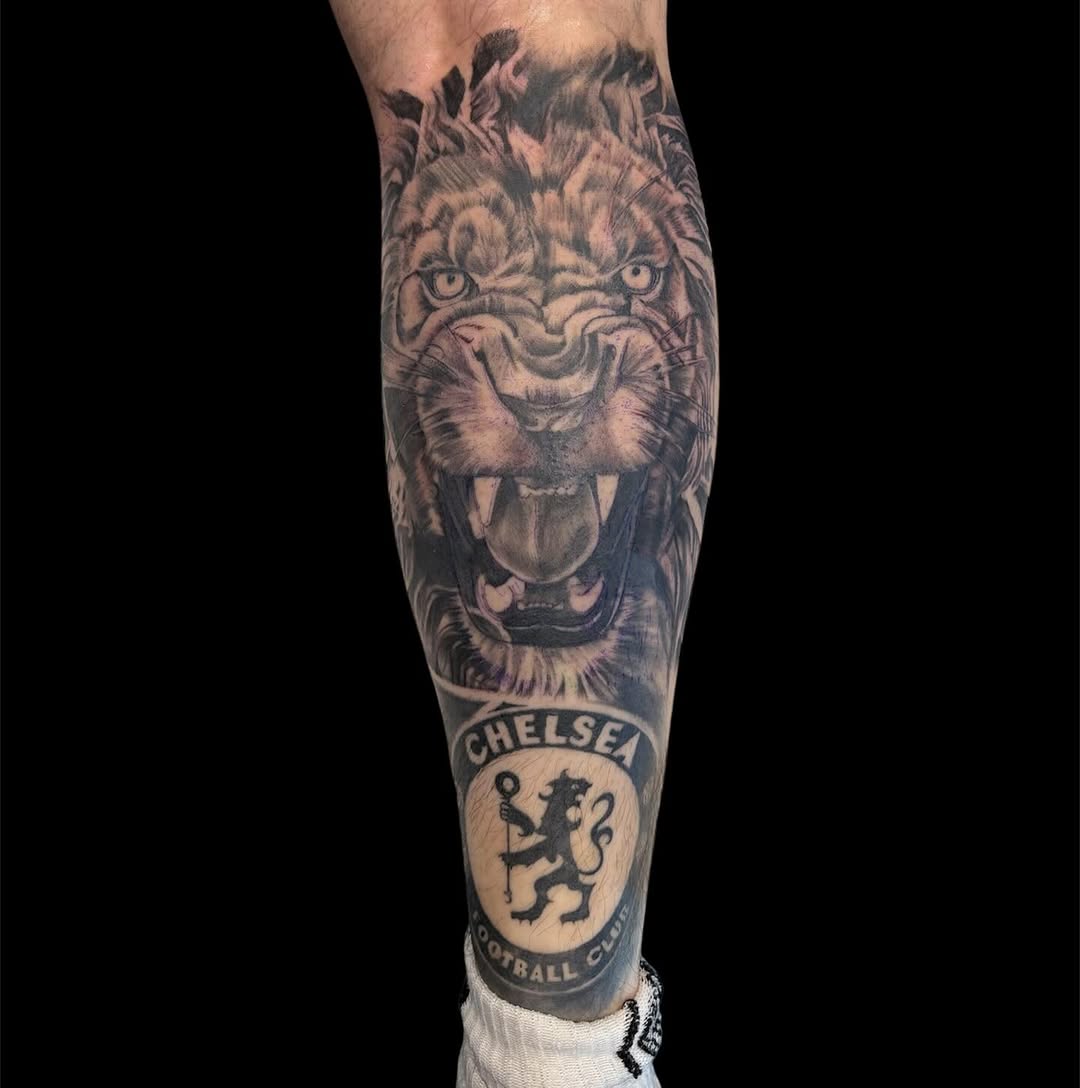 Roaring lion and Chelsea FC logo realism tattoo on the forearm by @inkwitatlas