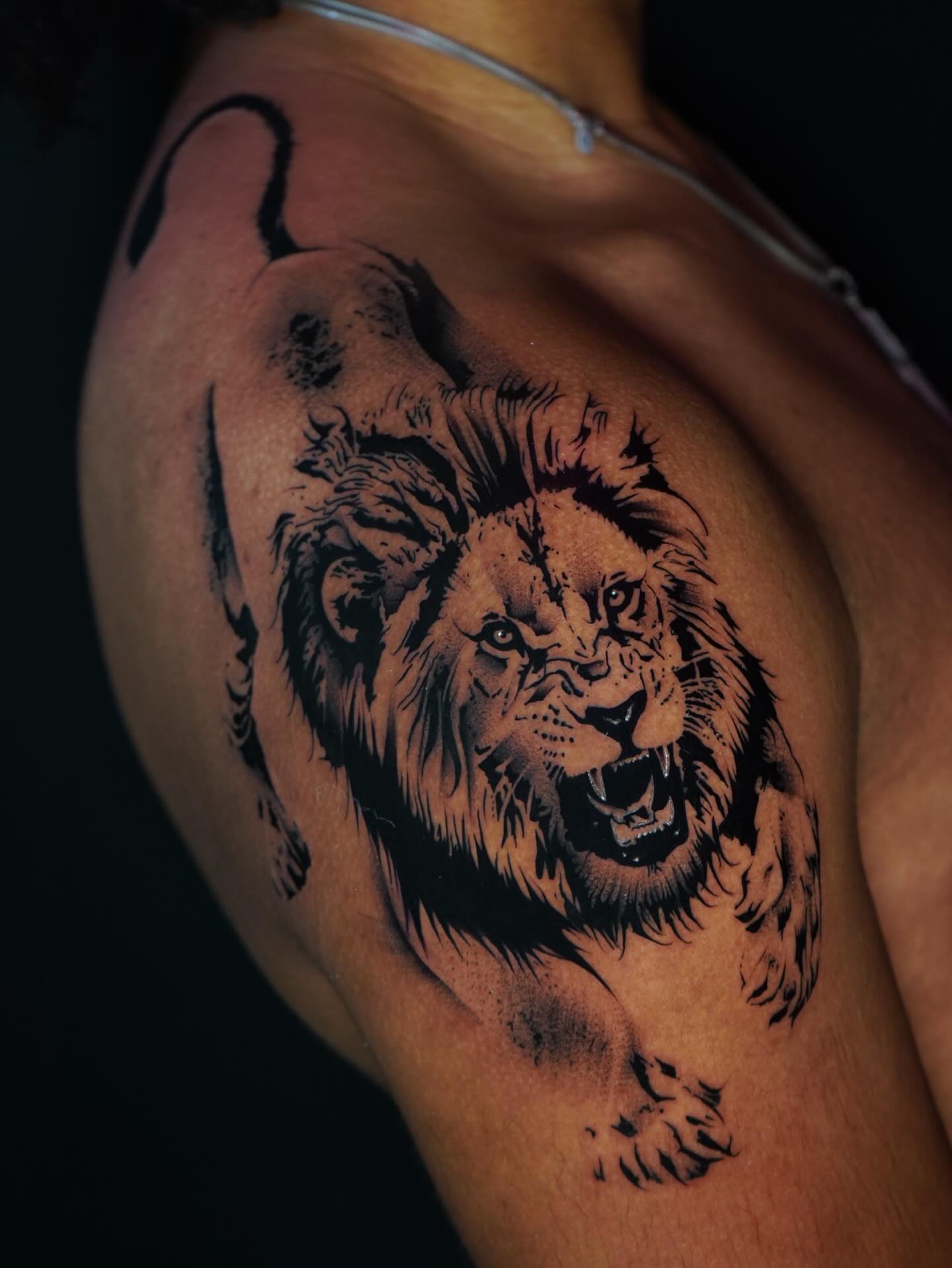 Lion realism tattoo on the shoulder by orlando