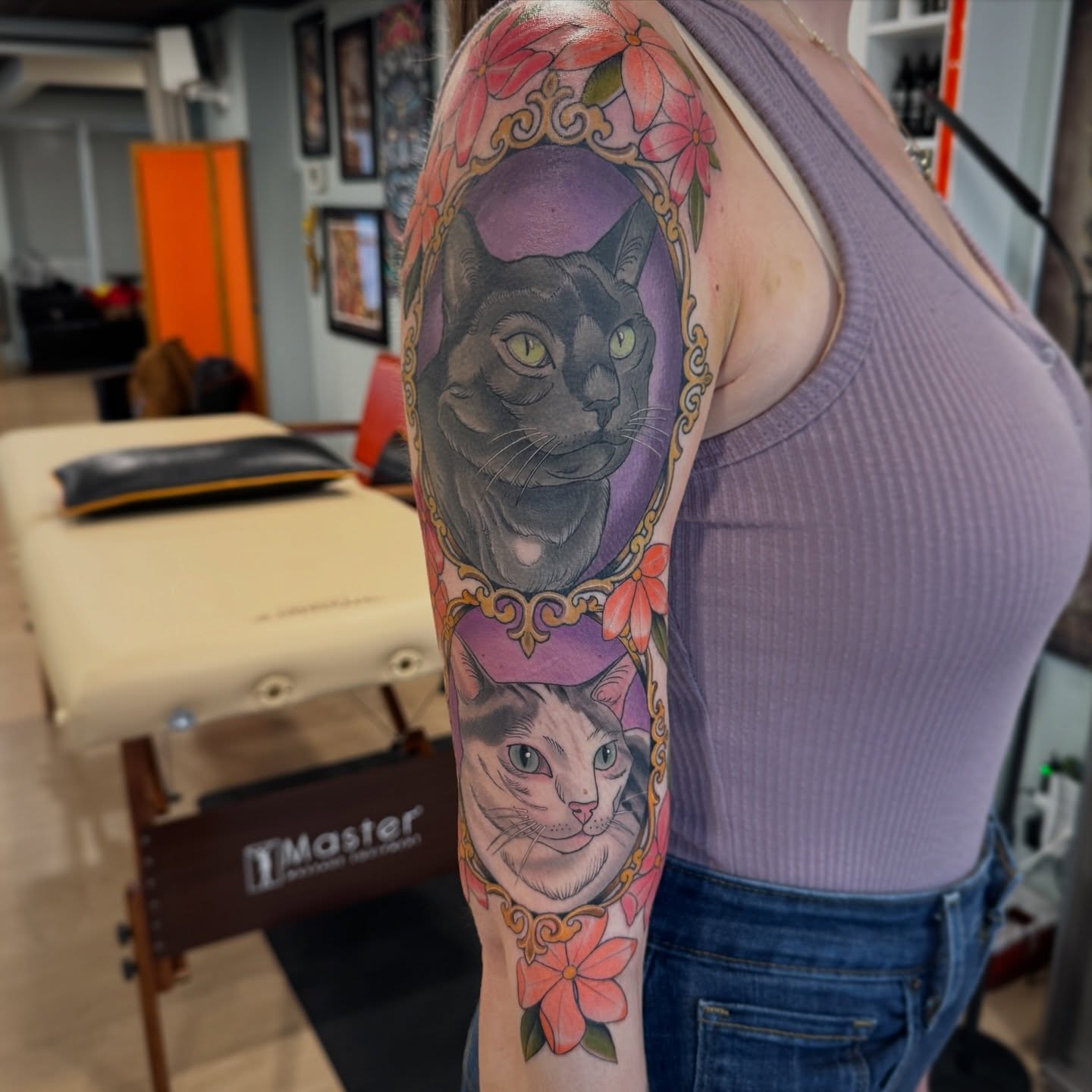 Cat realism tattoo on the upper arm by Kaley, Des Moines, Iowa