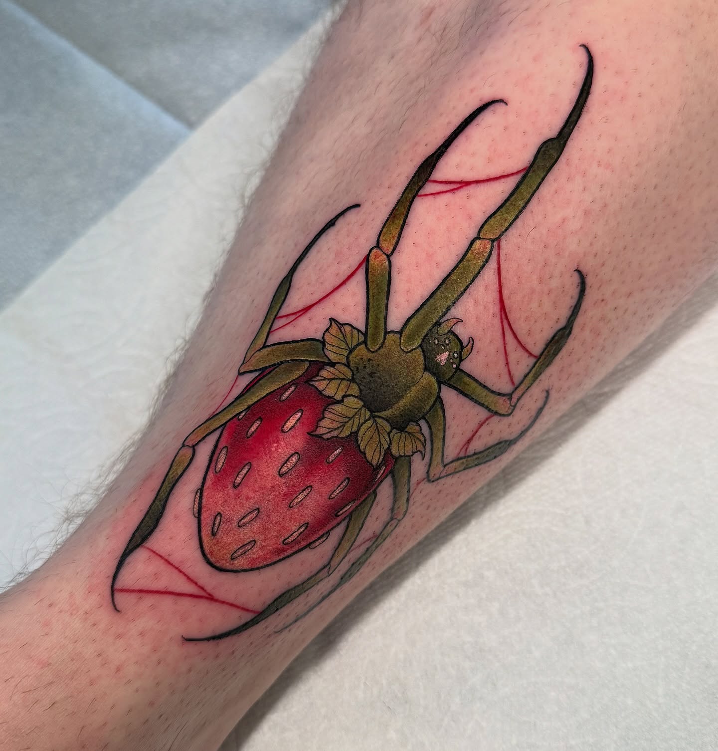 Strawberry spider American traditional tattoo on the forearm by Maia Papaya Tattoos 🐝 Olympia Tattoo Artist