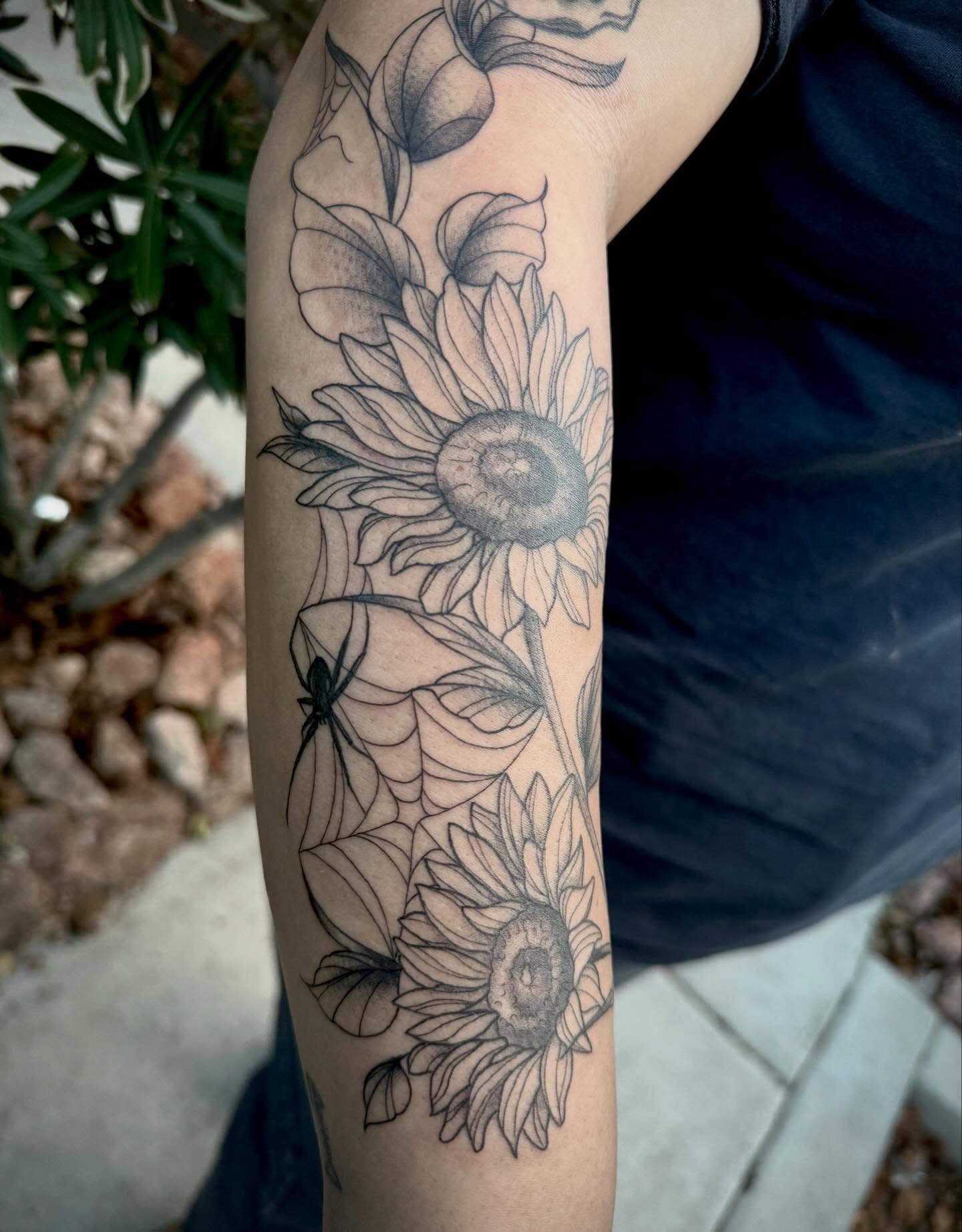 Sunflowers black and grey tattoo on the forearm by abbie michelle
