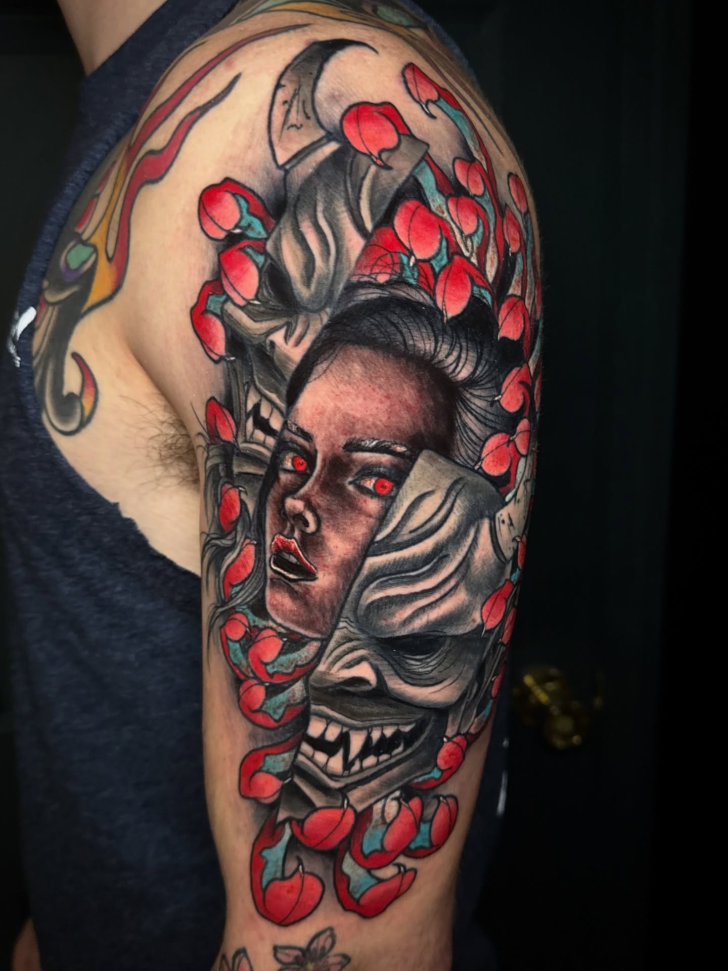 Woman and mask realism tattoo on the forearm by Mitch McGarry