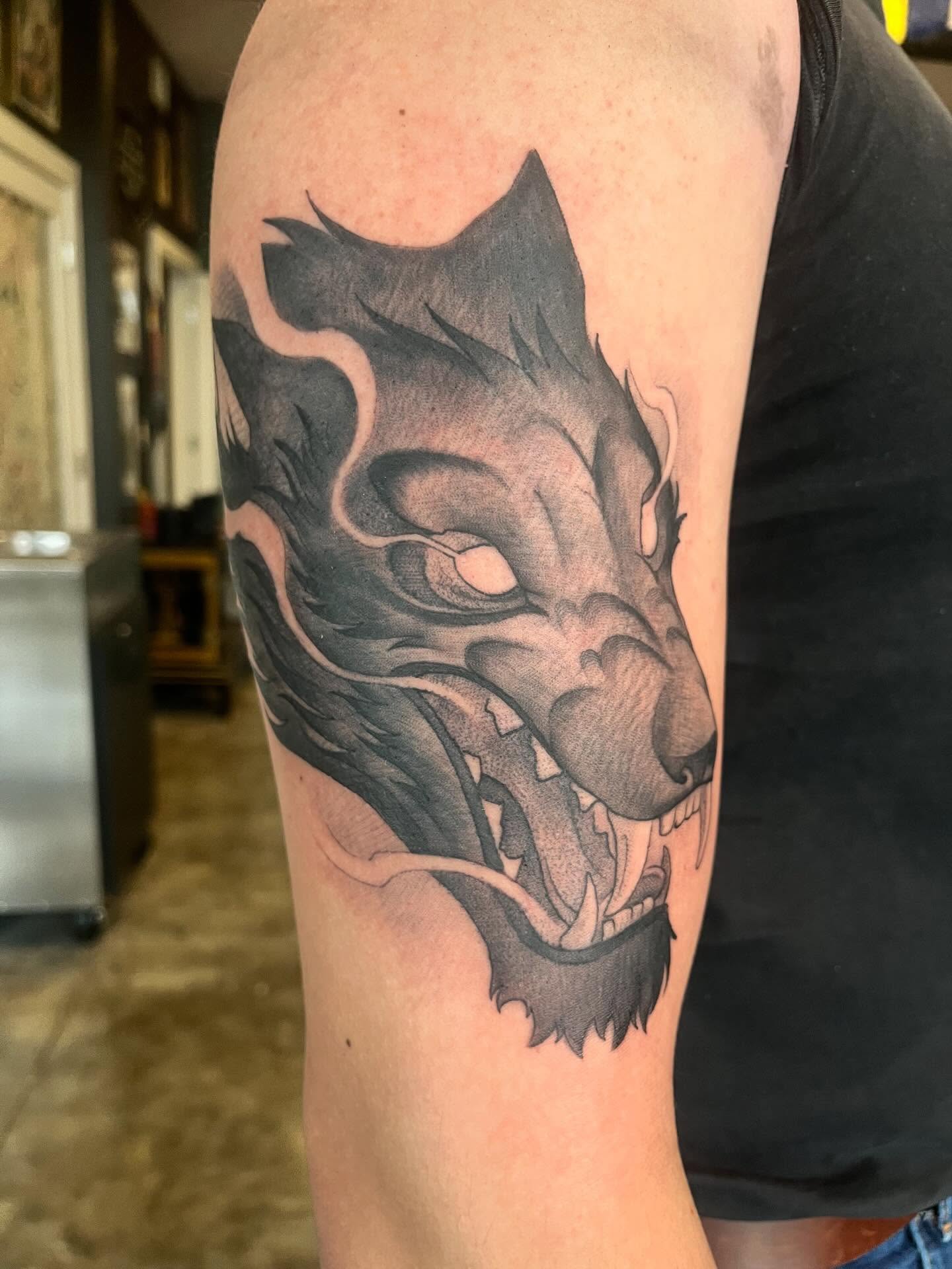 Wolf realism tattoo on the forearm by Ian White