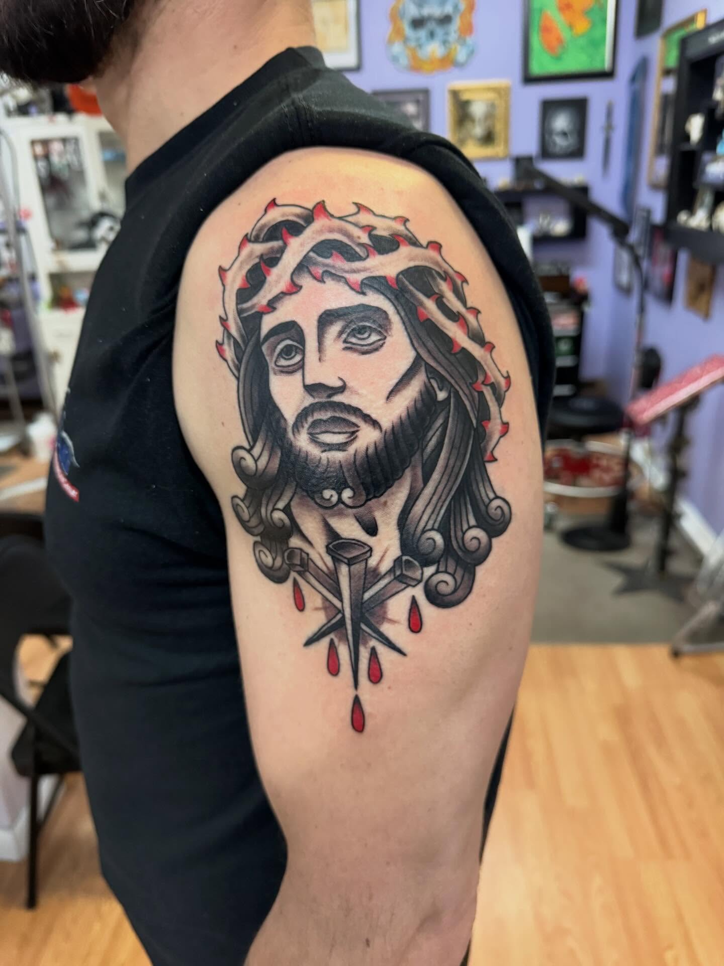 Religious figure American traditional tattoo on the shoulder by Justin Fiveson