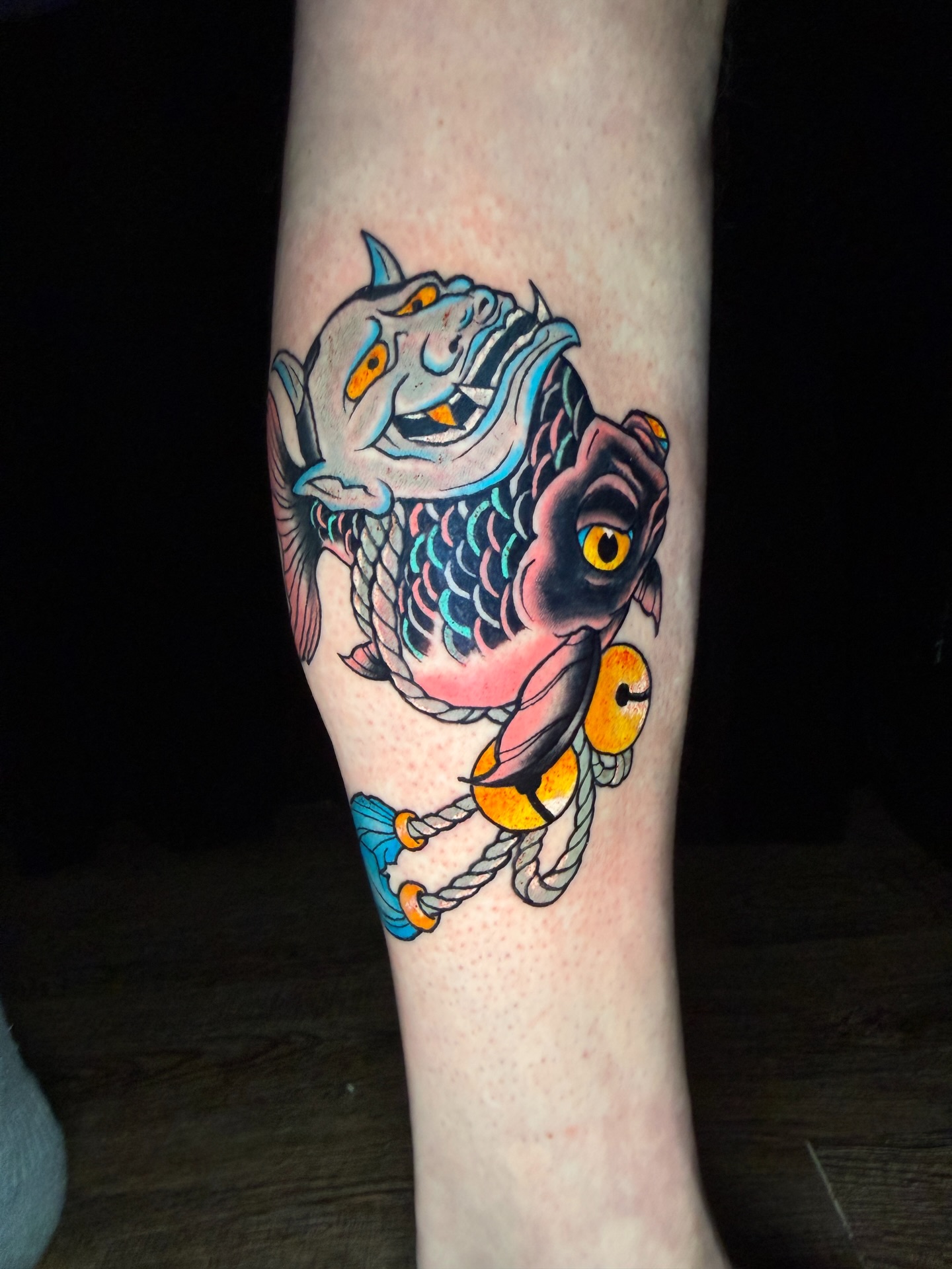 Koi fish and oni mask Japanese tattoo on the forearm by Ty Hamilton