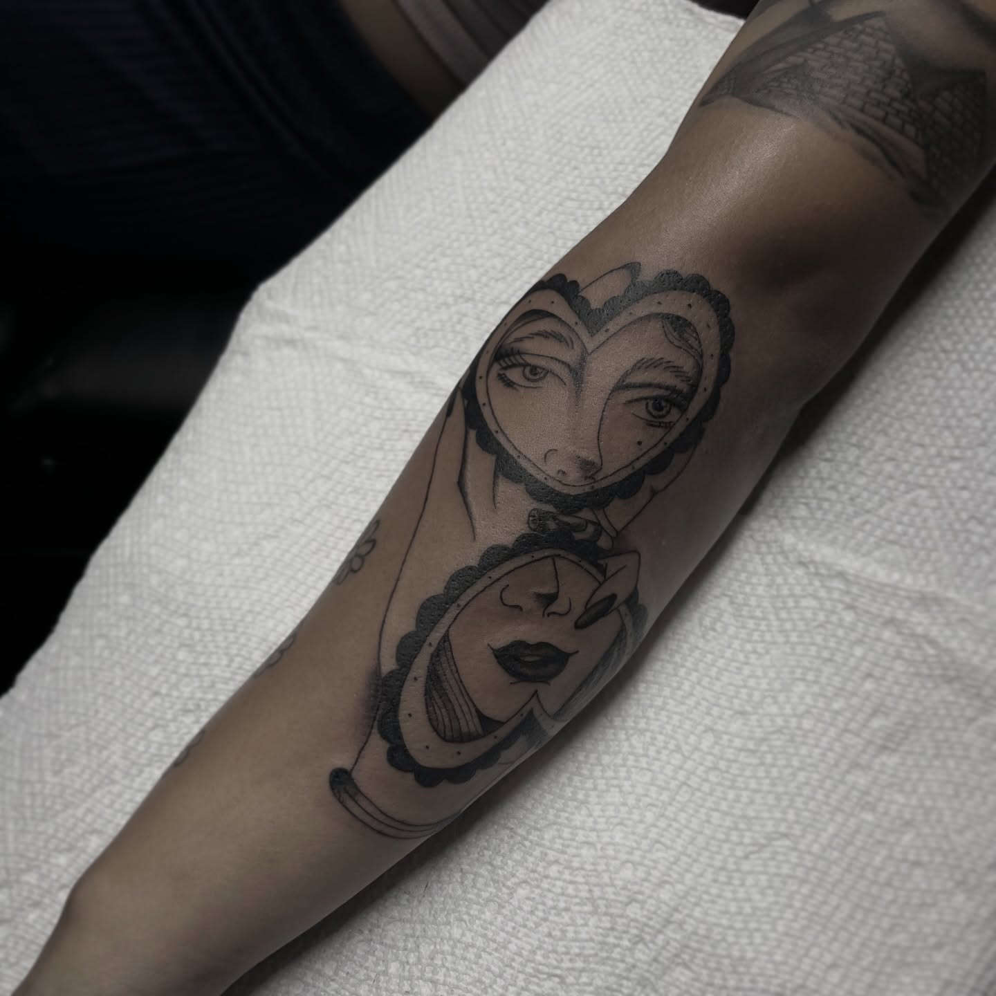 Woman's face black and grey tattoo on the forearm by suzie