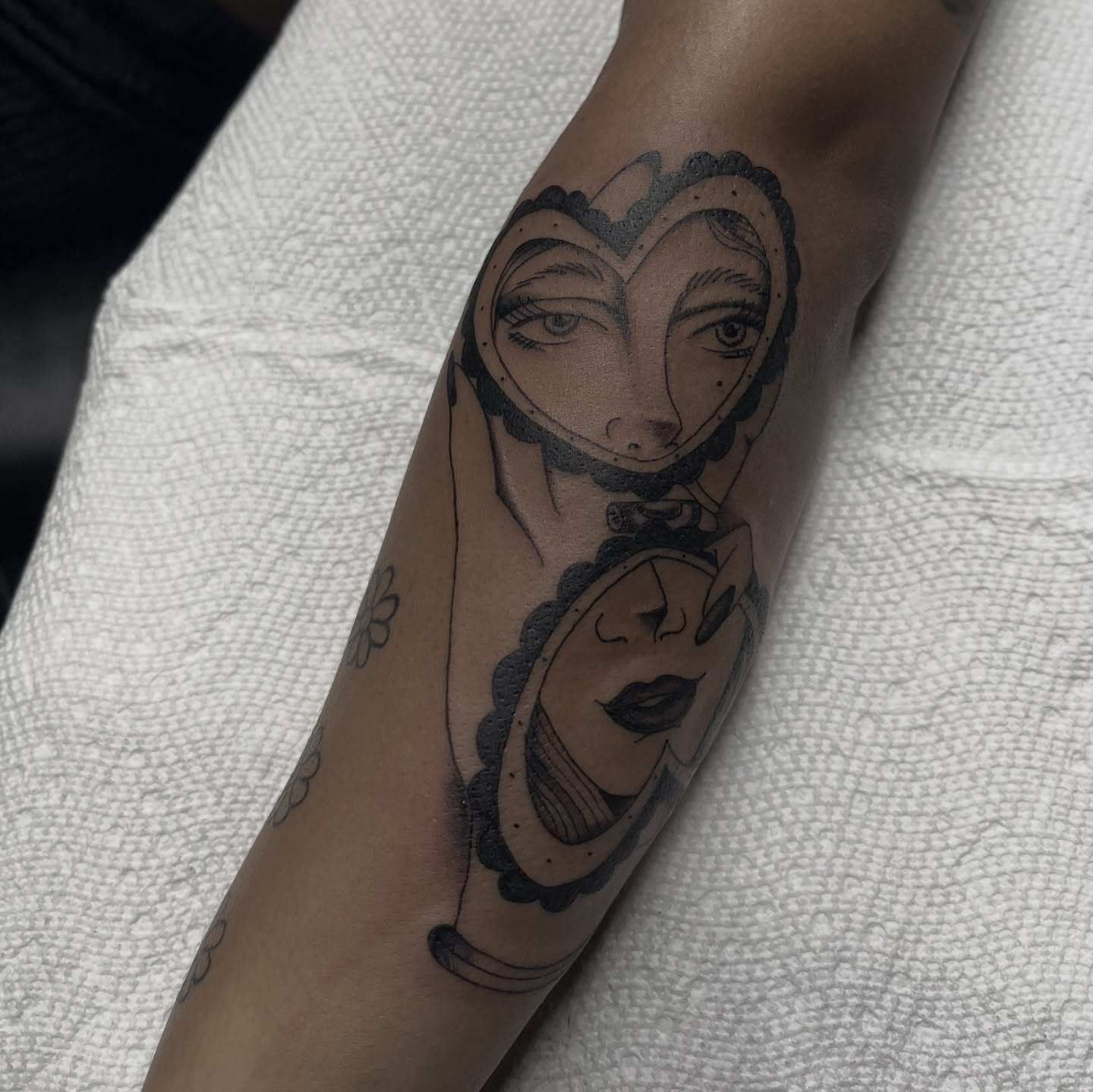 Woman's face black and grey tattoo on the forearm by suzie