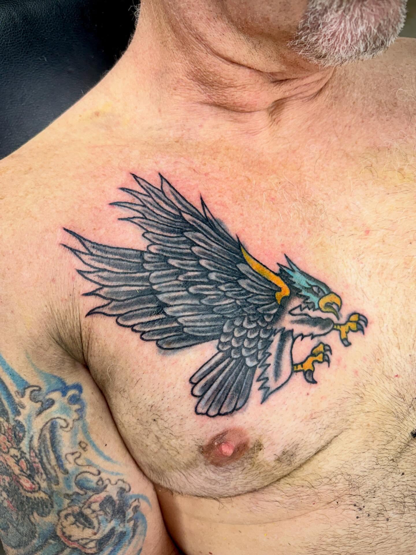 Eagle American traditional tattoo on the chest by Ali Calis
