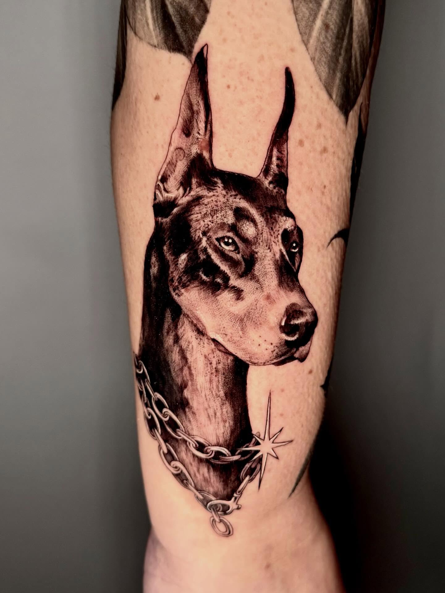 Doberman realism tattoo on the forearm by Joi Bailey, Denton, Texas