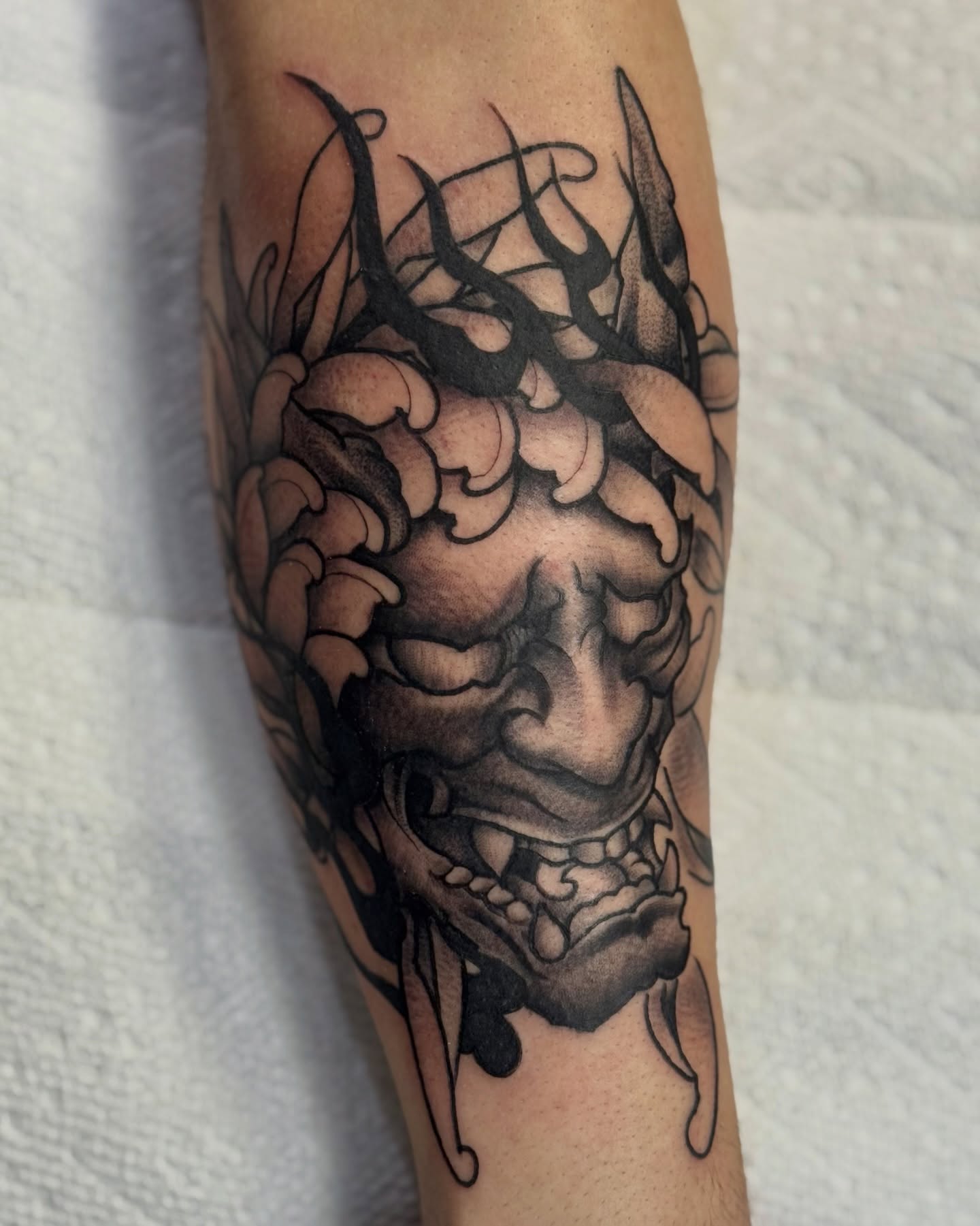 Demon head dark realism tattoo on the forearm by Mish