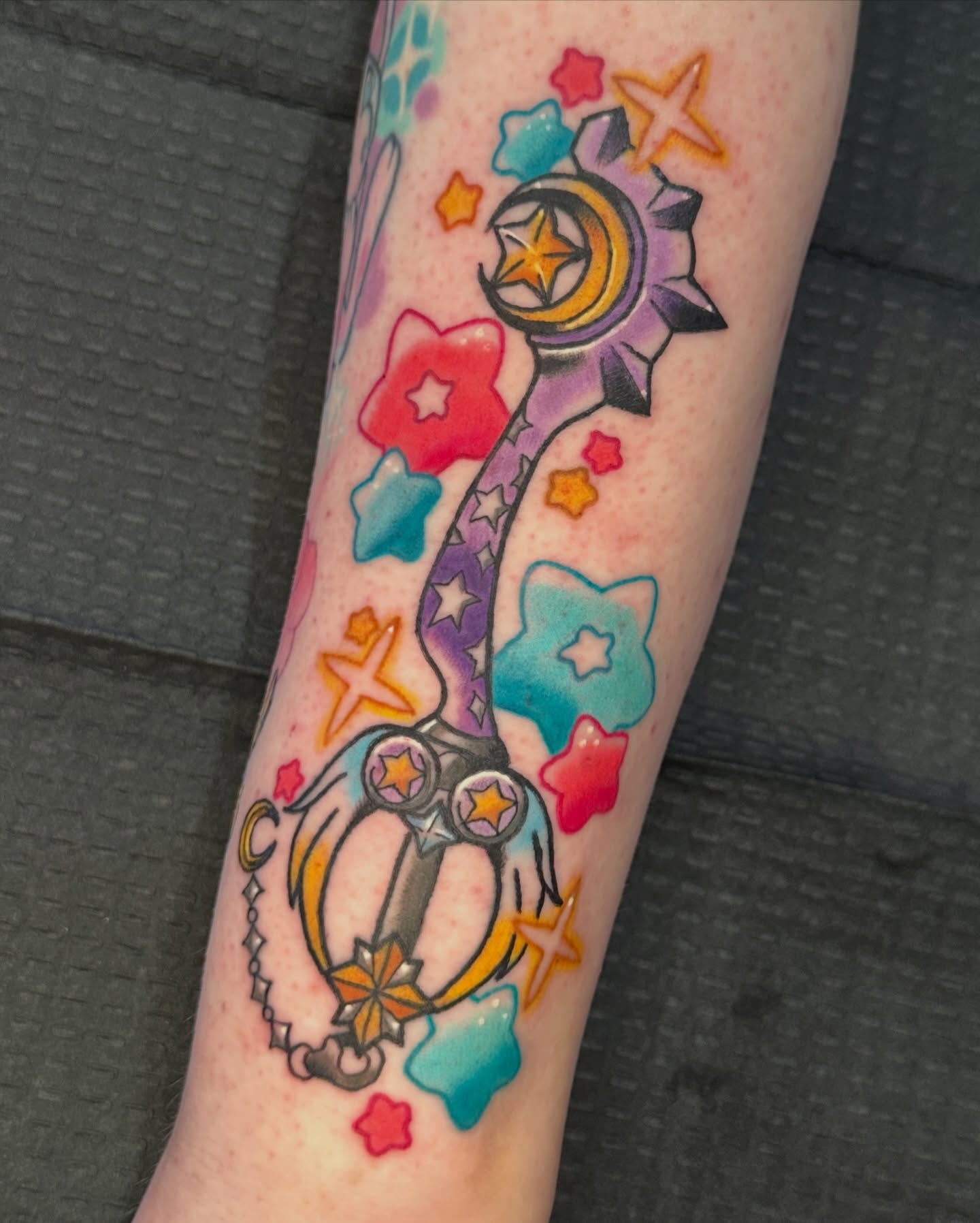 Magical staff new school tattoo on the forearm by Paige Ochoa