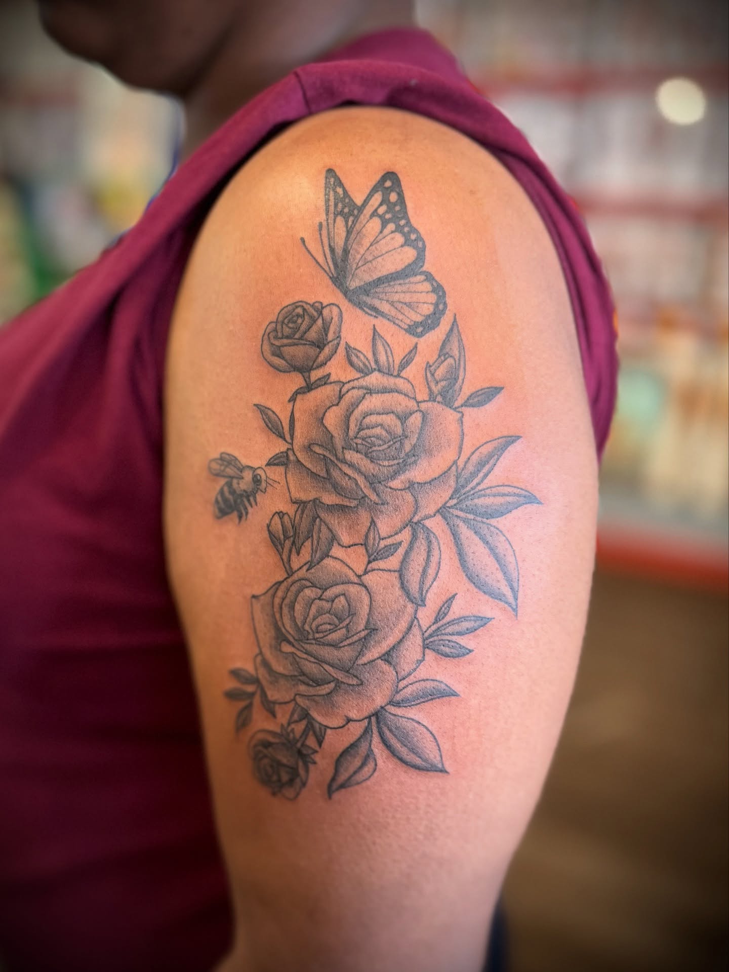 Roses and butterfly black and grey tattoo on the shoulder by Justin Bianchini - New Orleans Tattoo Artist