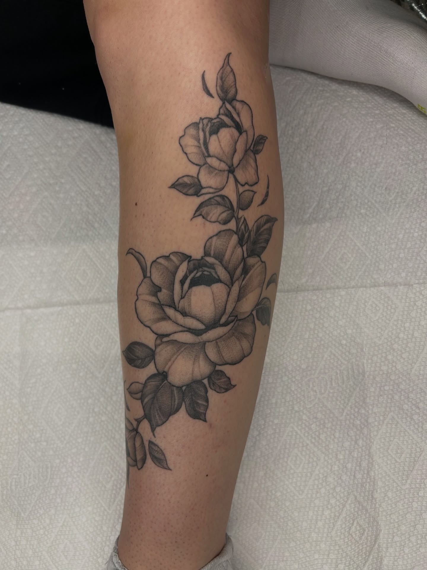 Roses black and grey tattoo on the calf by Austin C Pratt-Fusari