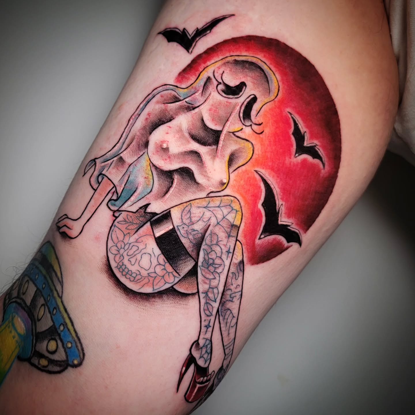 Woman with bats American traditional tattoo on the thigh by Randyz Tattyz