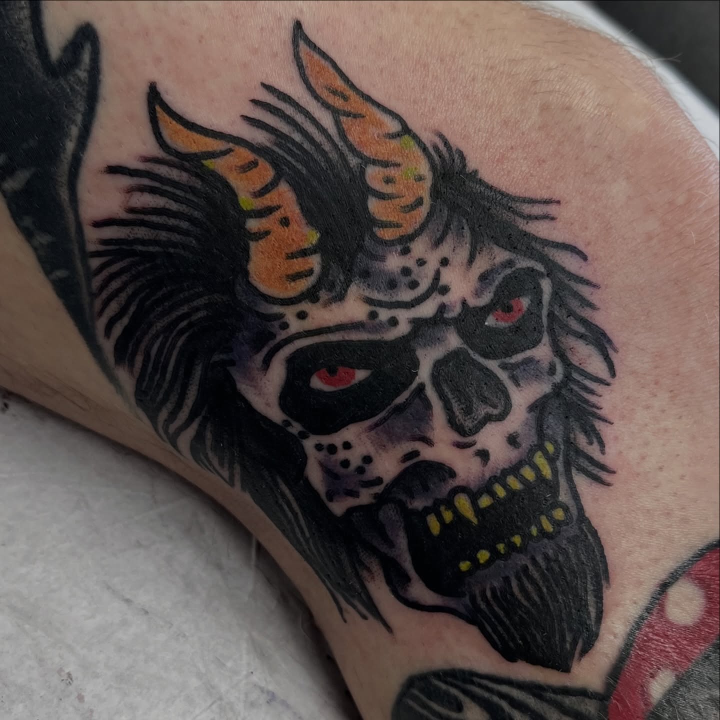 Skull with horns American traditional tattoo on the forearm by You’ll save me in your phone as Tattoo Tim