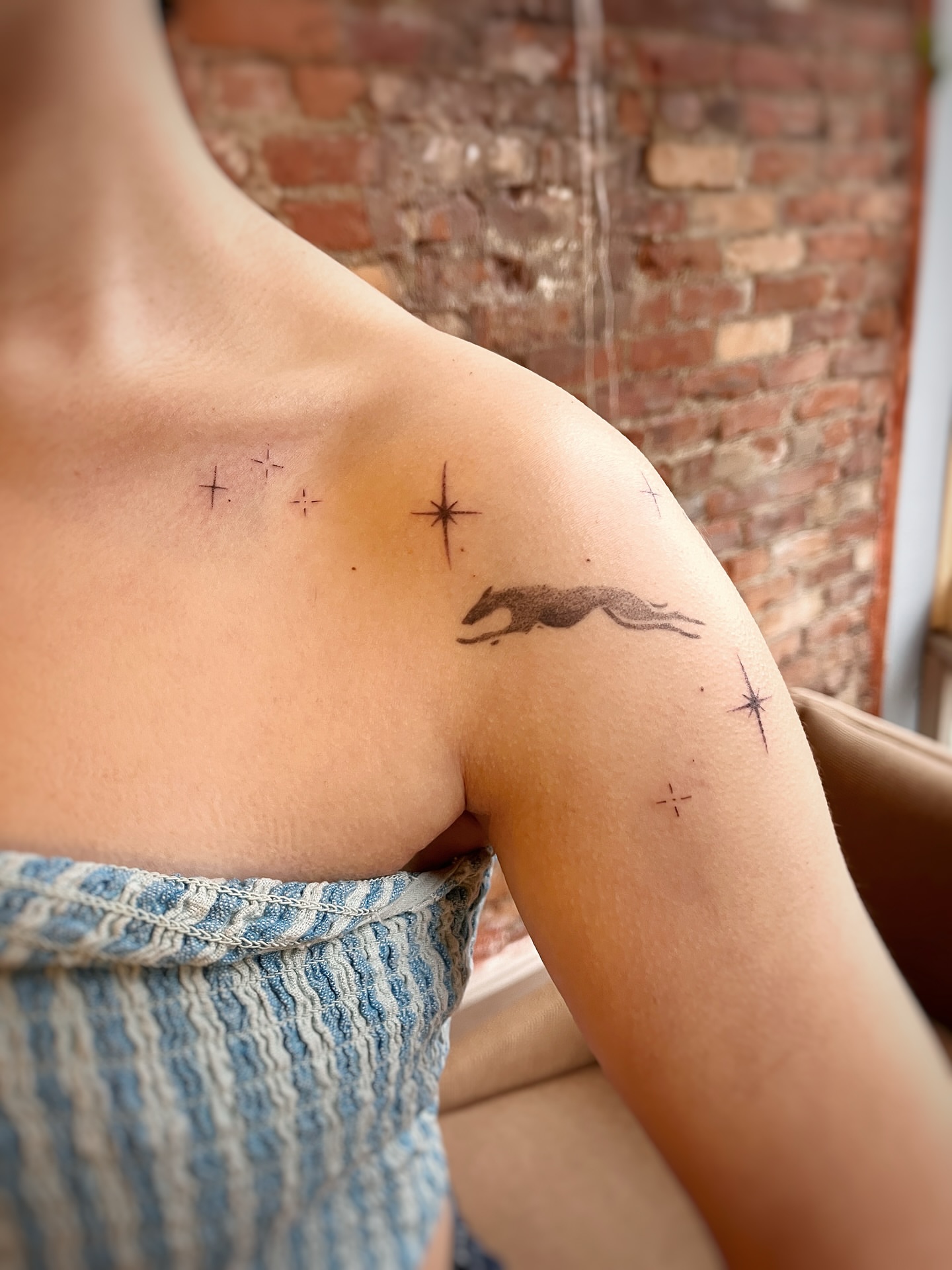 Fox black and grey tattoo on the shoulder by Risa Cincinnati Tattoo Artist