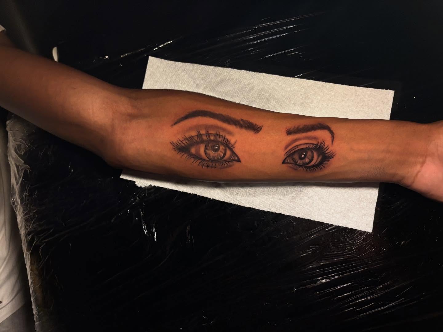Eyes realism tattoo on the forearm by Inkys Tatts