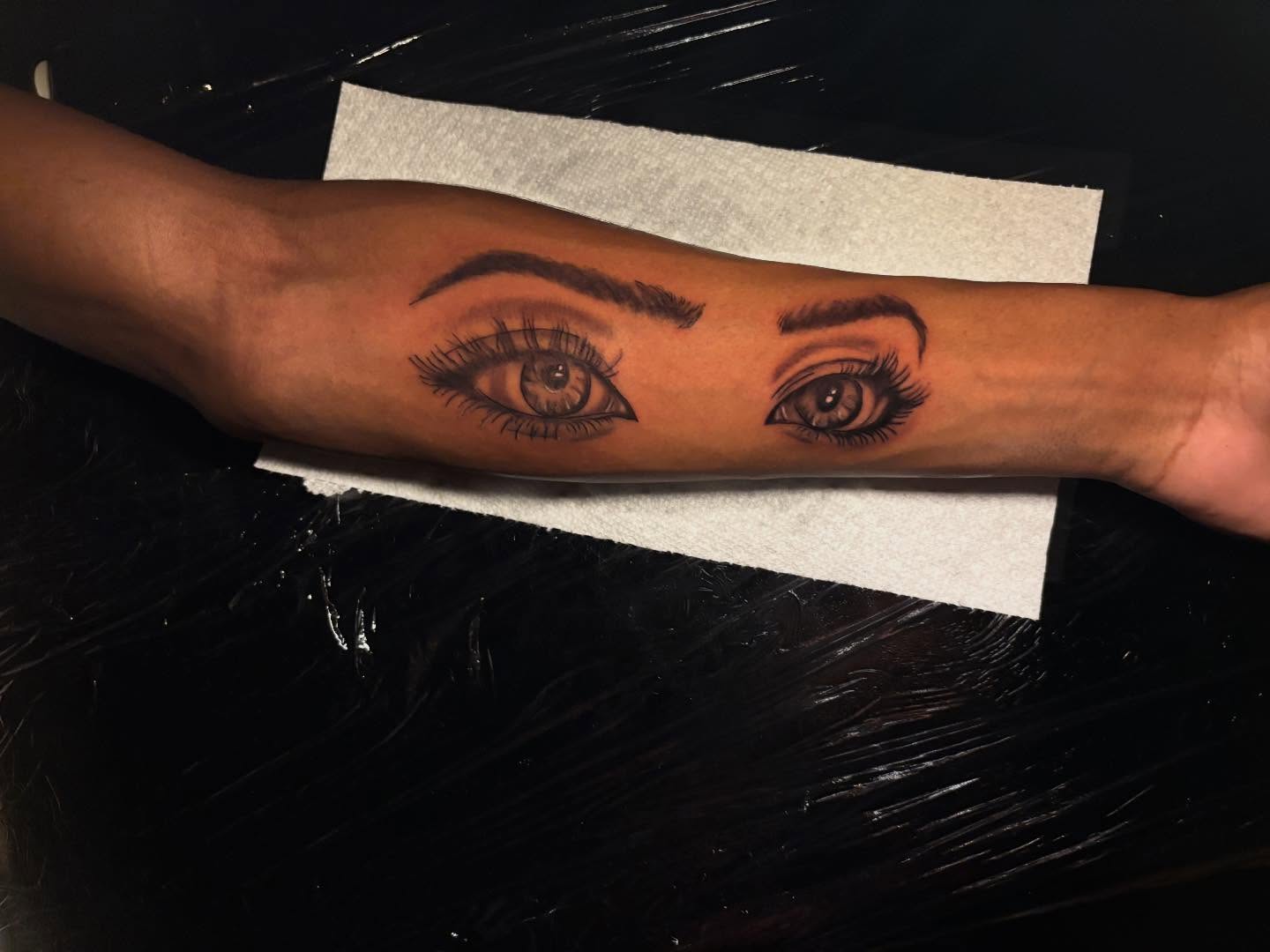 Eyes realism tattoo on the forearm by Inkys Tatts