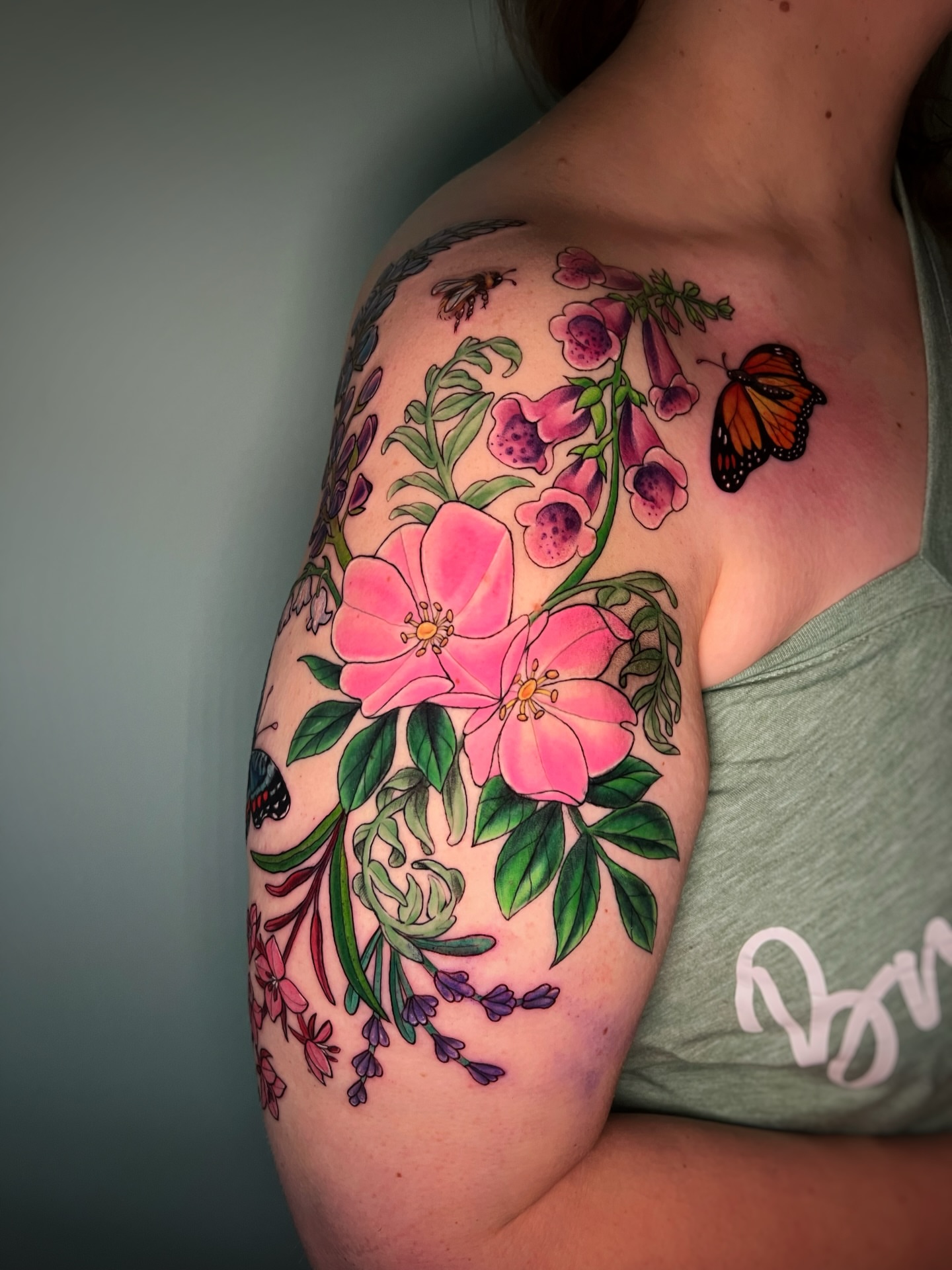 Flowers and butterfly realism tattoo on the shoulder by Michelle Pomerantz 🌼 Portland Tattoo Artist