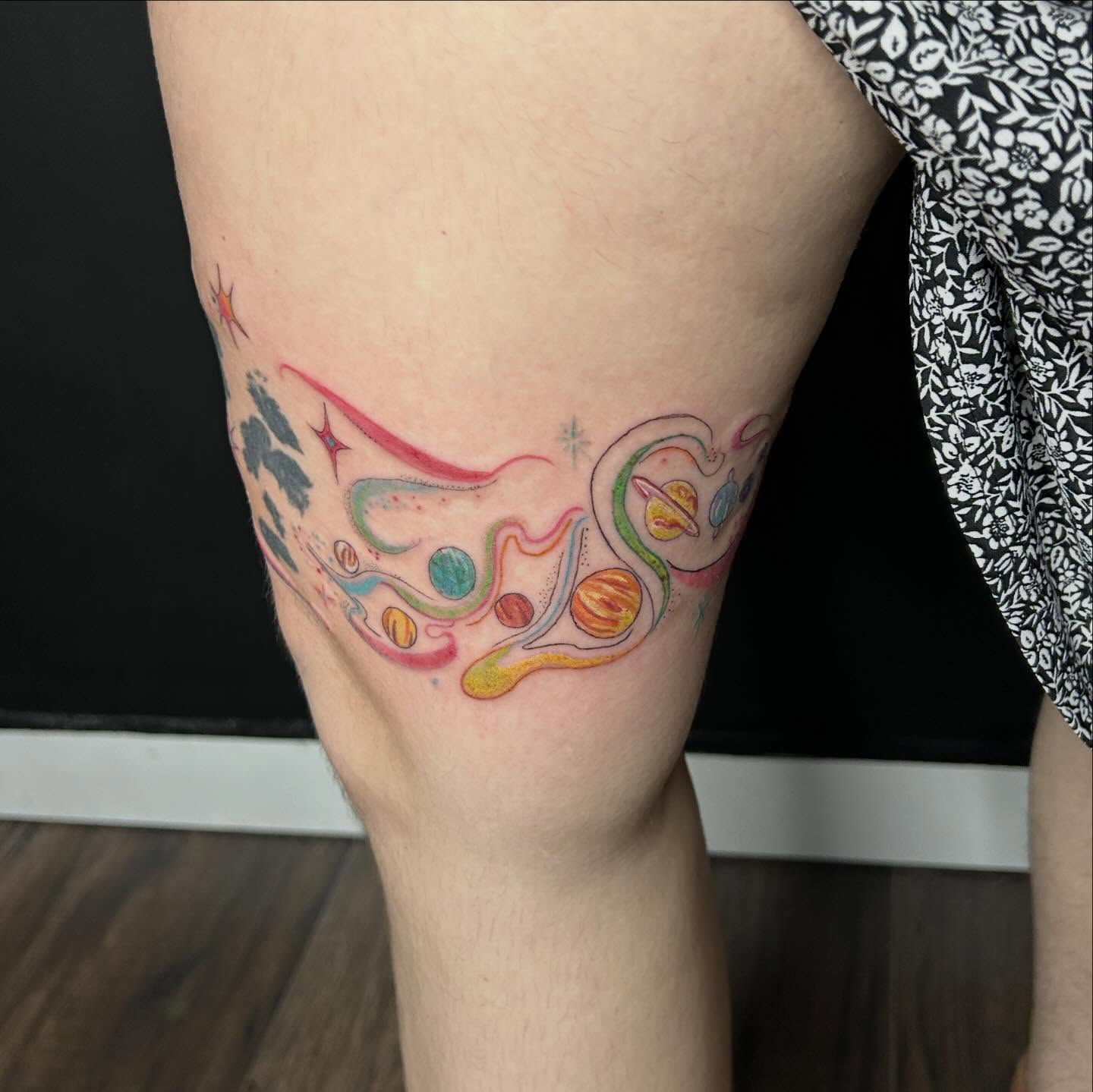 Space-themed design new school tattoo on the thigh by Elizabeth (Lib), Murfreesboro, Tennessee