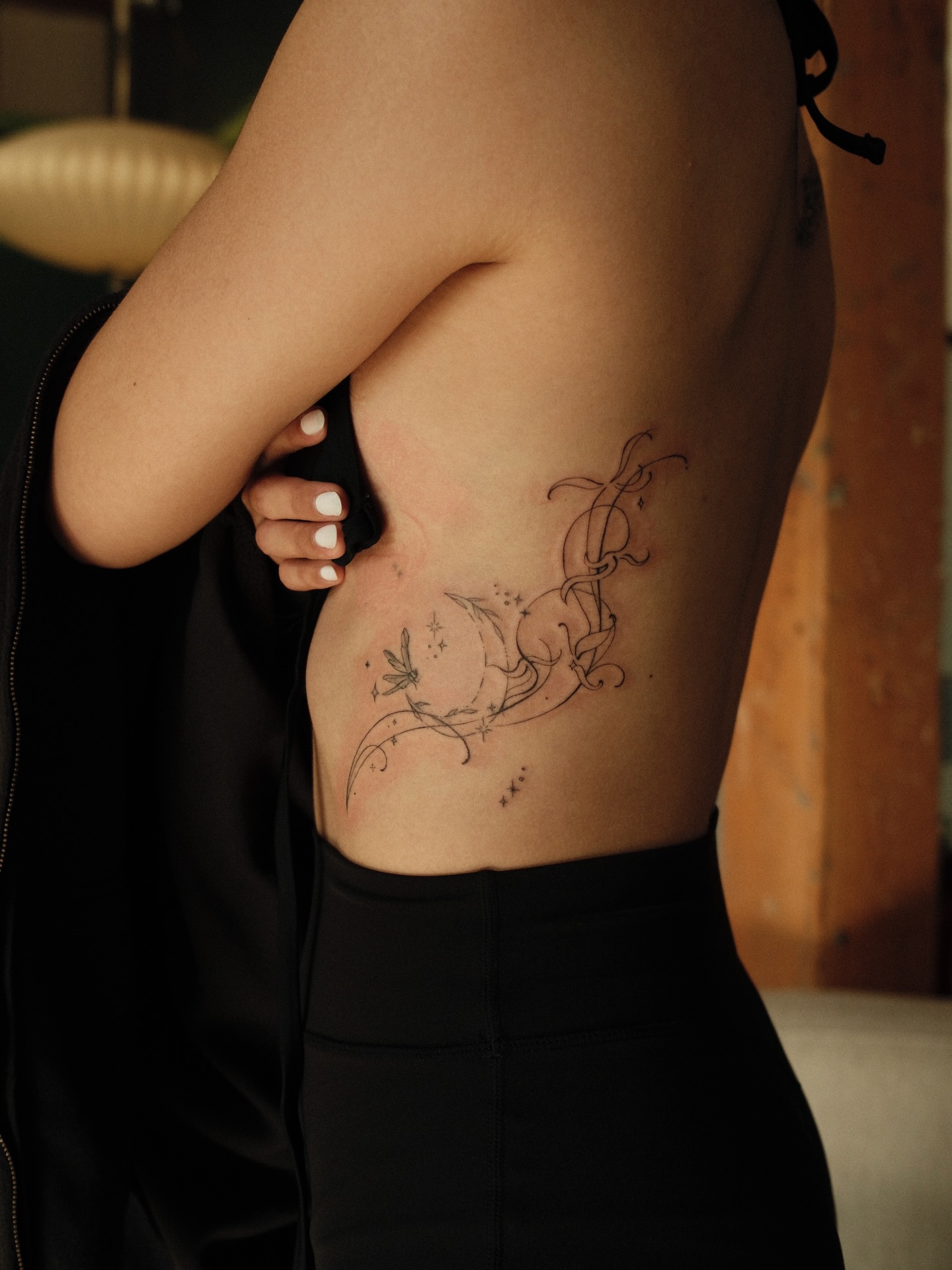 Swirling dragonfly and abstract swirls fine line tattoo on the ribs by v?