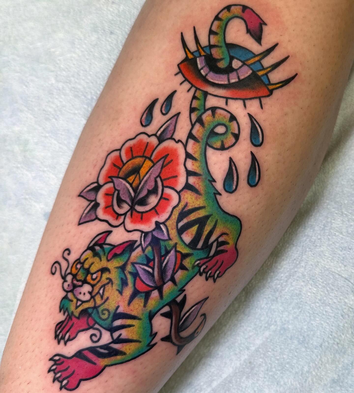 Tiger and flower American traditional tattoo on the forearm by ࿊ Emma Sloan Tattoos ࿊, Austin, Texas