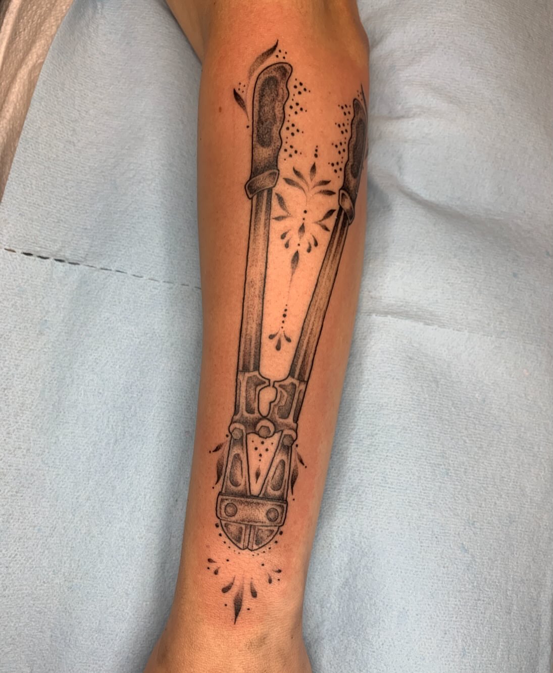 Sword dotwork tattoo on the forearm by Kitty Jones, Berkeley, California