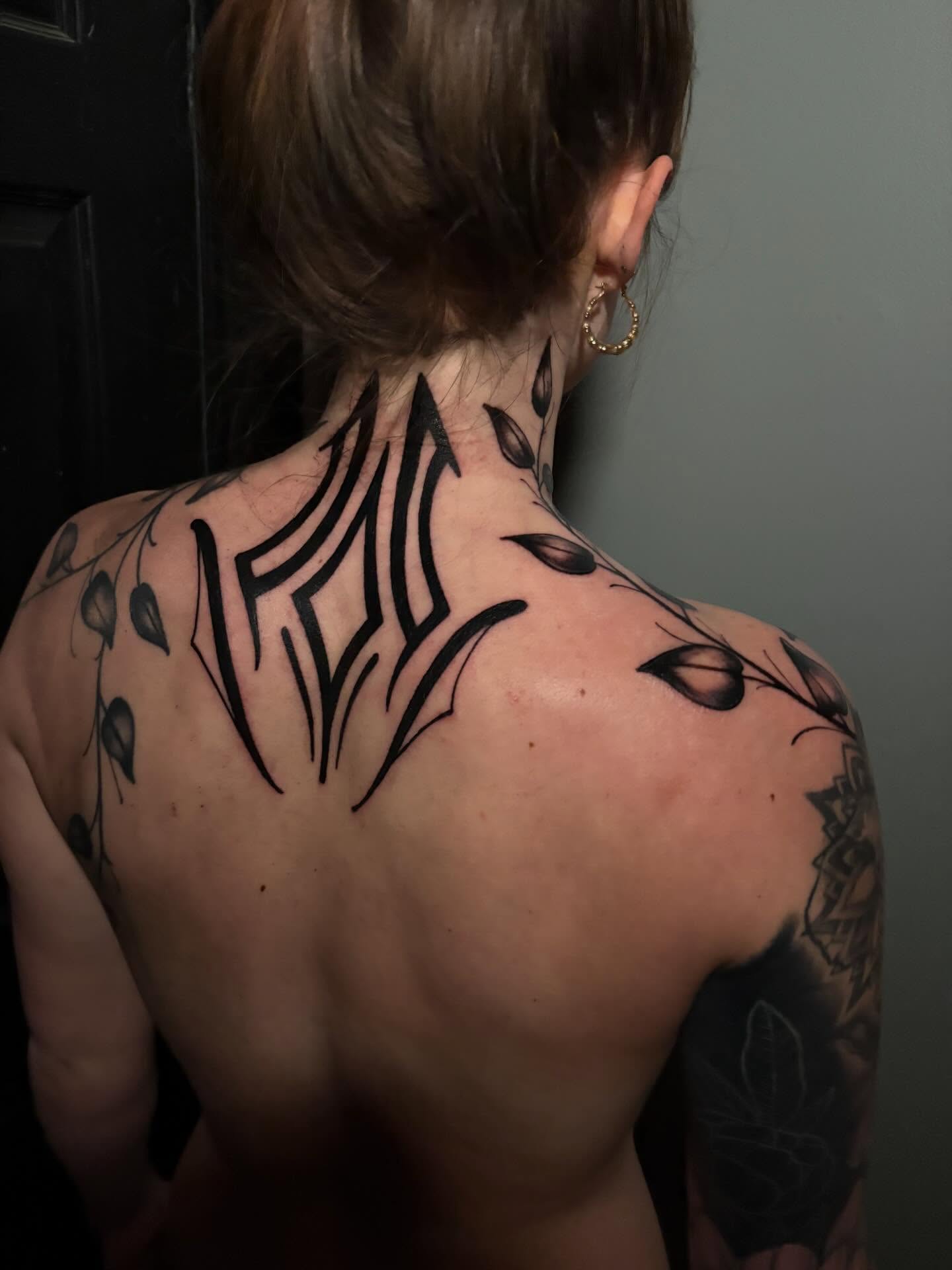 Tribal tribal tattoo on the back by Cameron Scofield