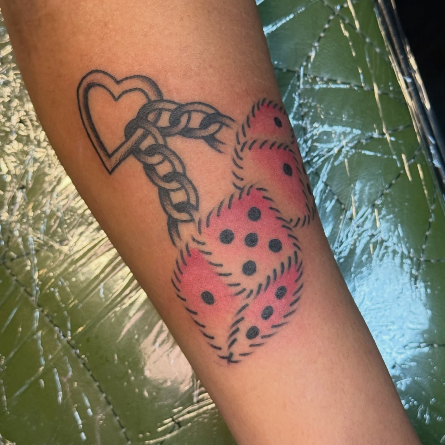 Heart and chain dotwork tattoo on the forearm by Traddy Maddie ๐