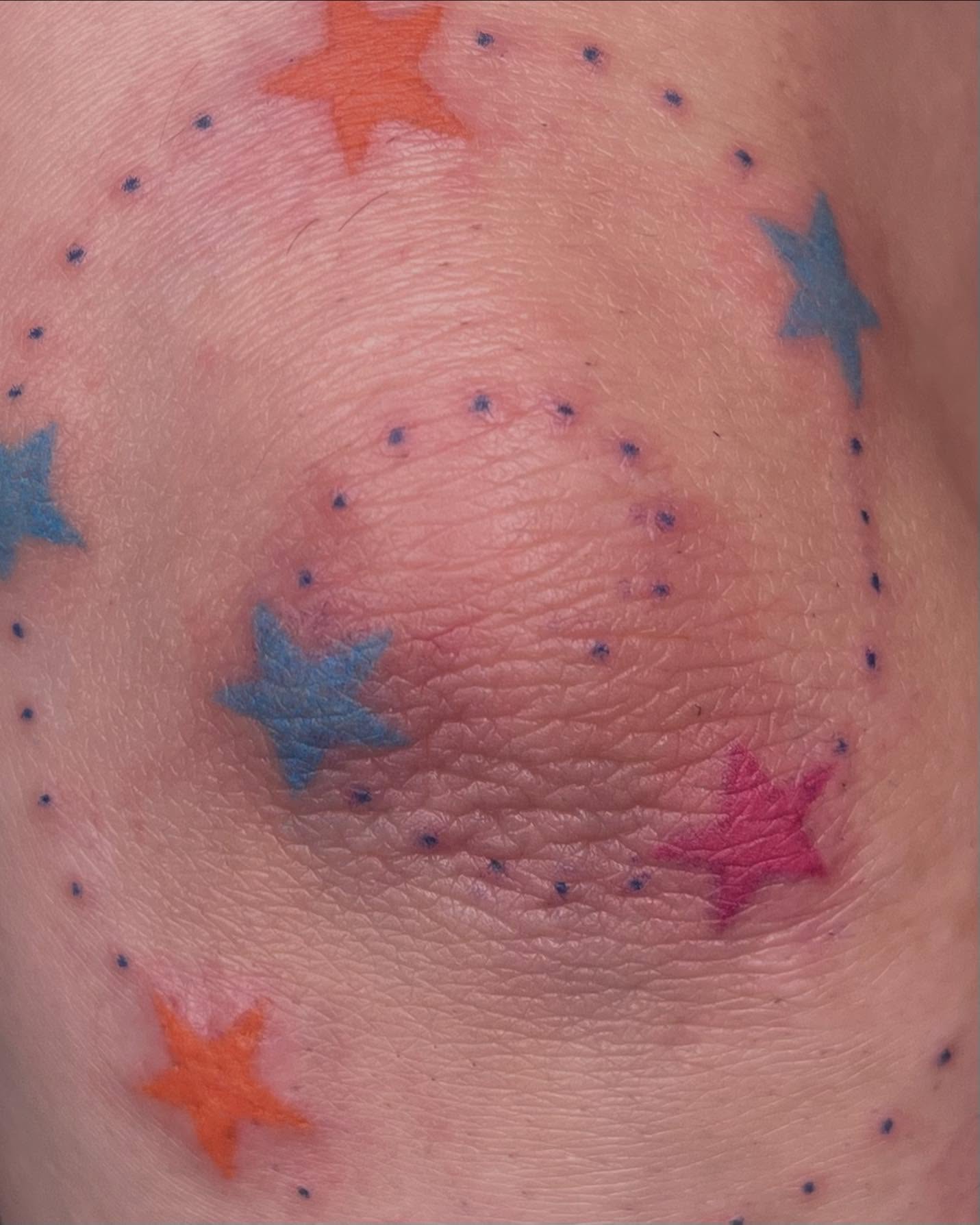 Stars dotwork tattoo on the chest by Jenna