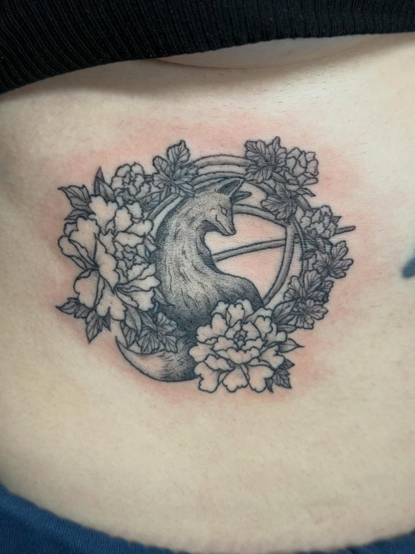 Goat and flowers black and grey tattoo on the torso by Camryn Justice