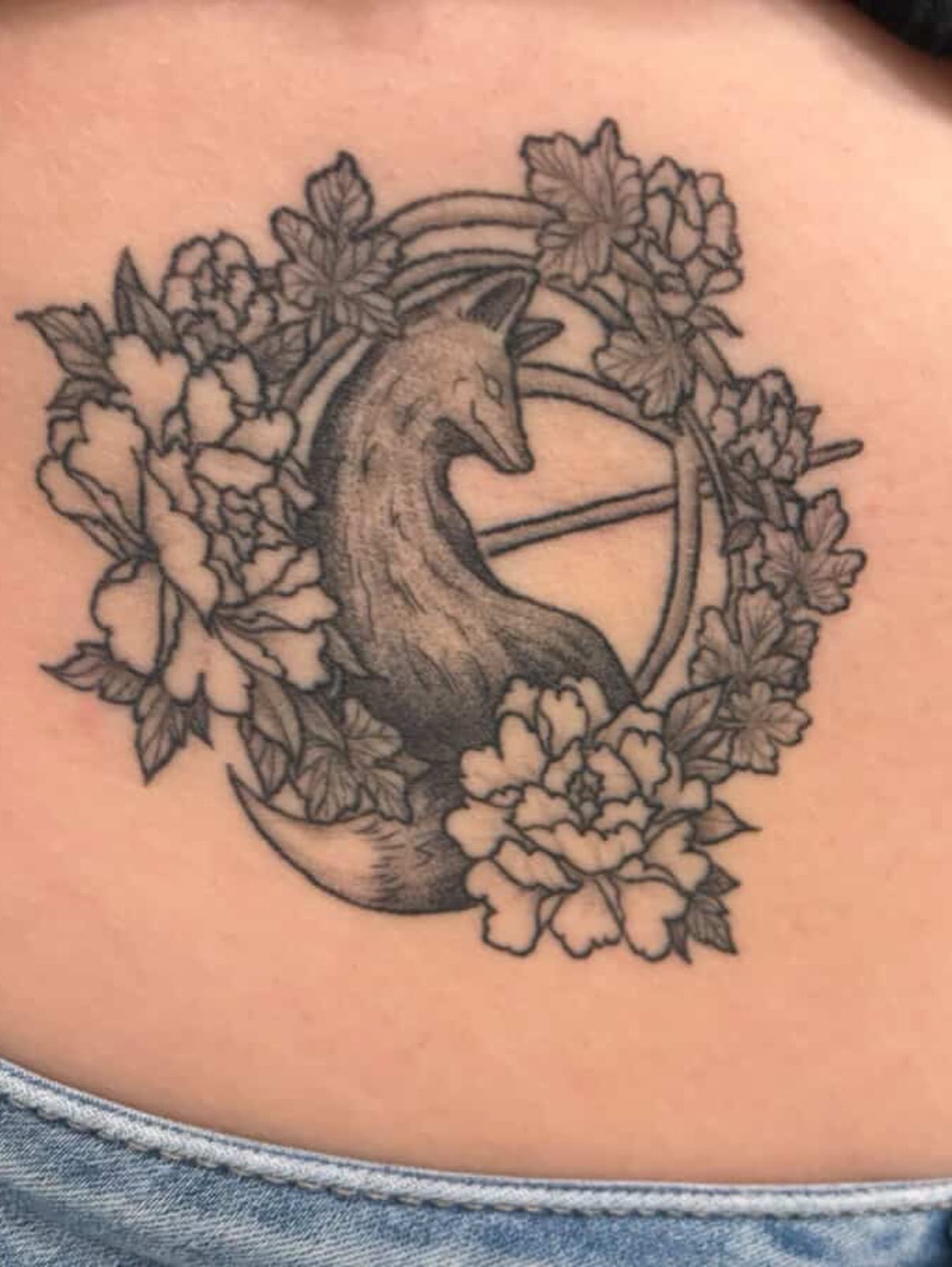 Fox and flowers black and grey tattoo on the torso by Camryn Justice