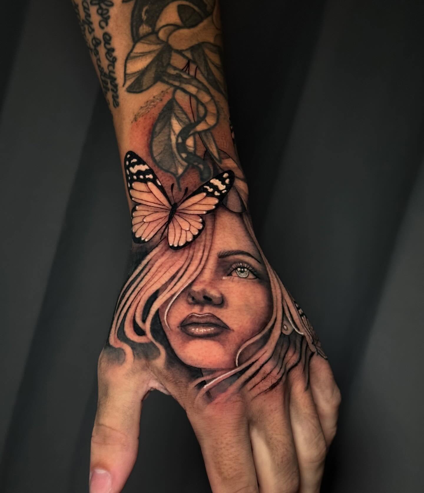 Woman's face with butterflies realism tattoo on the forearm by Andreanna Rosemarie Gabranidis, Pennsauken, New Jersey