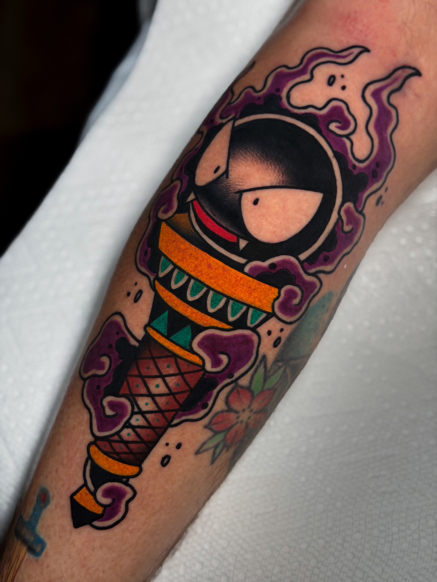 Astronaut ice cream cone American traditional tattoo on the forearm by Cory Cartwright