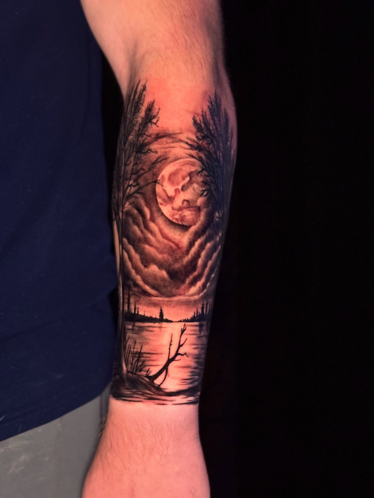 Moonlit landscape realism tattoo on the forearm by North County Sd