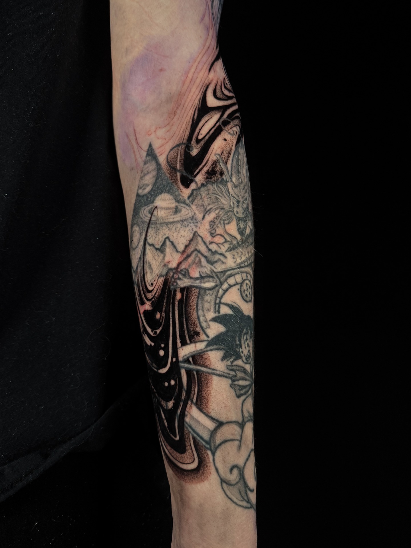 Mountain landscape dotwork tattoo on the forearm by Vince Lau