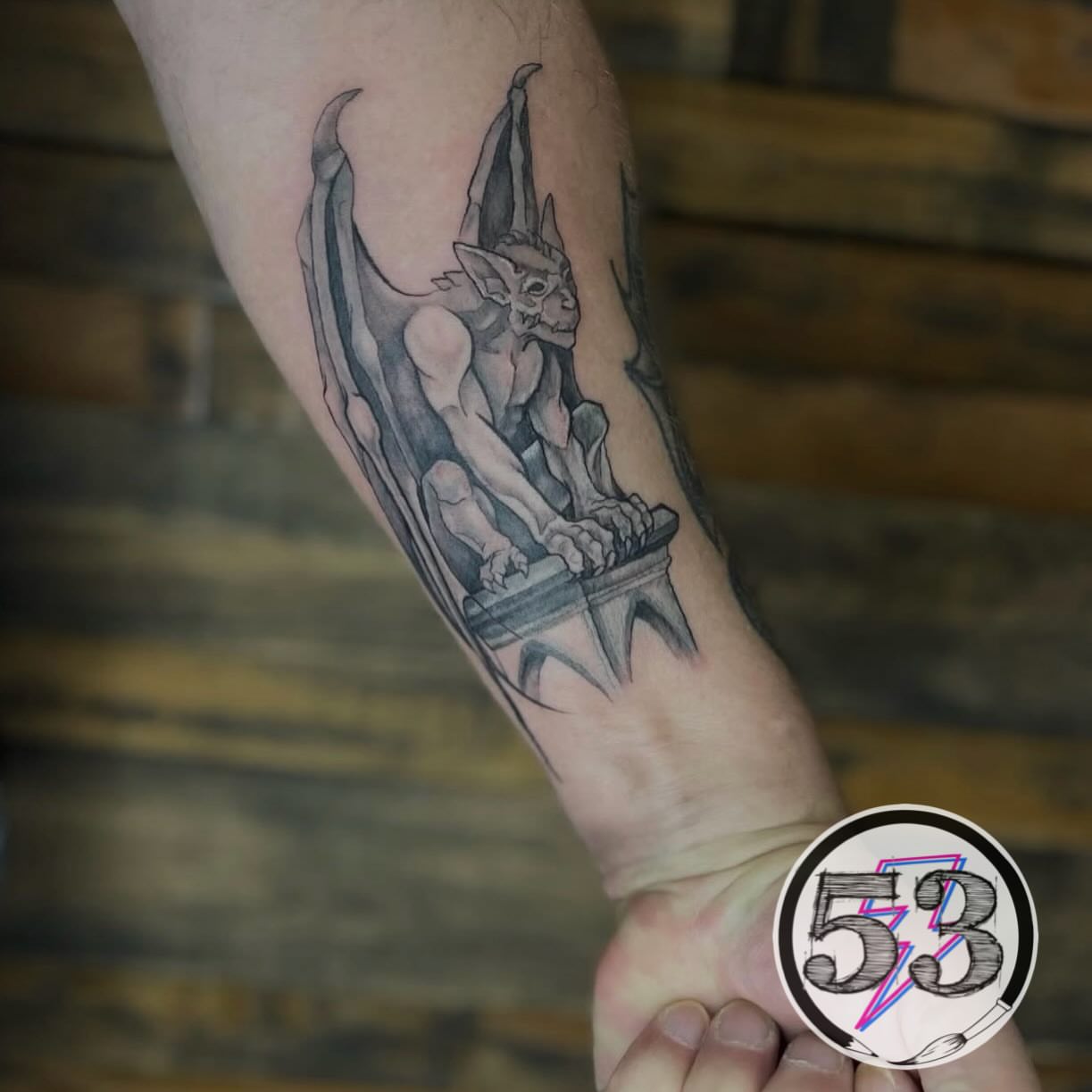 Gargoyle black and grey tattoo on the forearm by SHOP53 Tattoo & Art