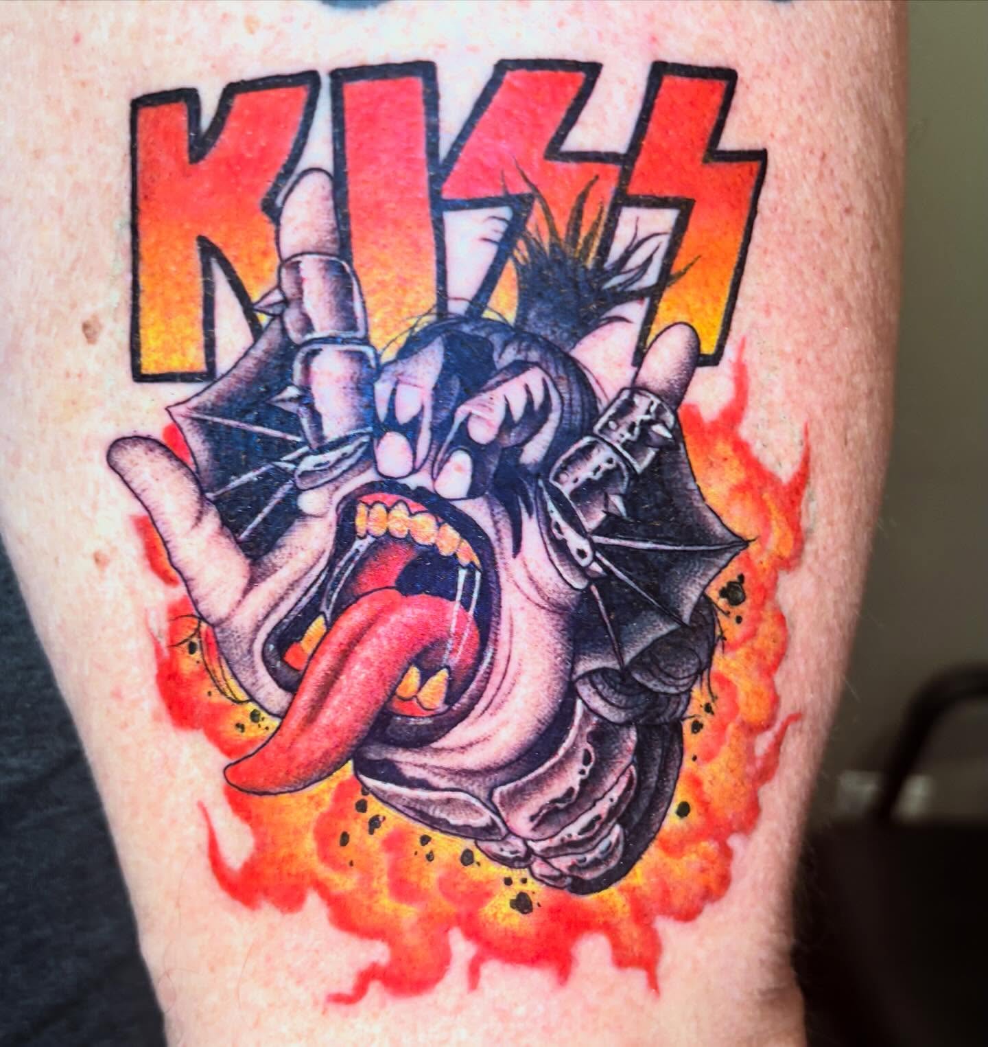 KISS band logo American traditional tattoo on the forearm by Eddie Wolfe
