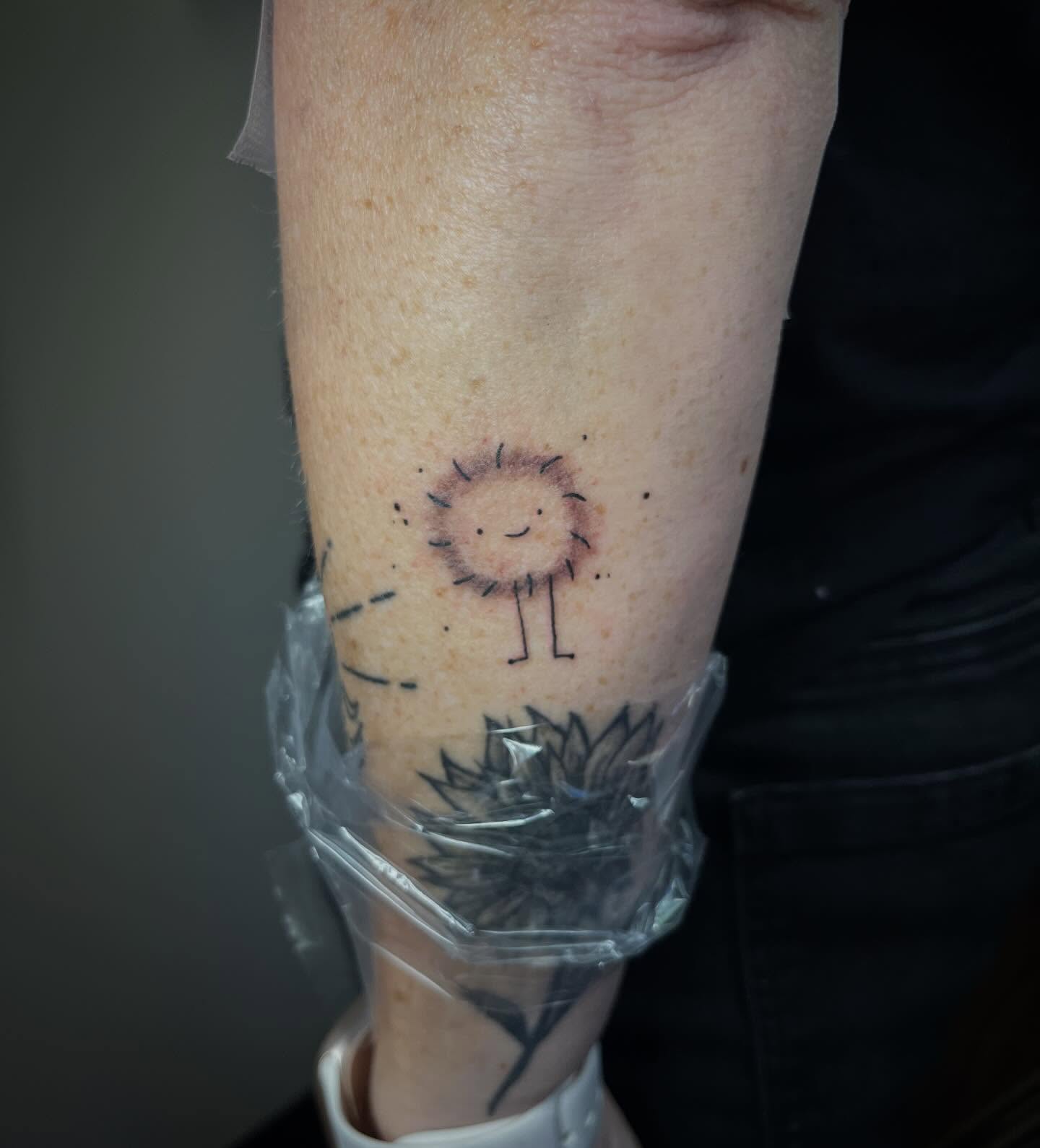 Sun dotwork tattoo on the forearm by Jazzy
