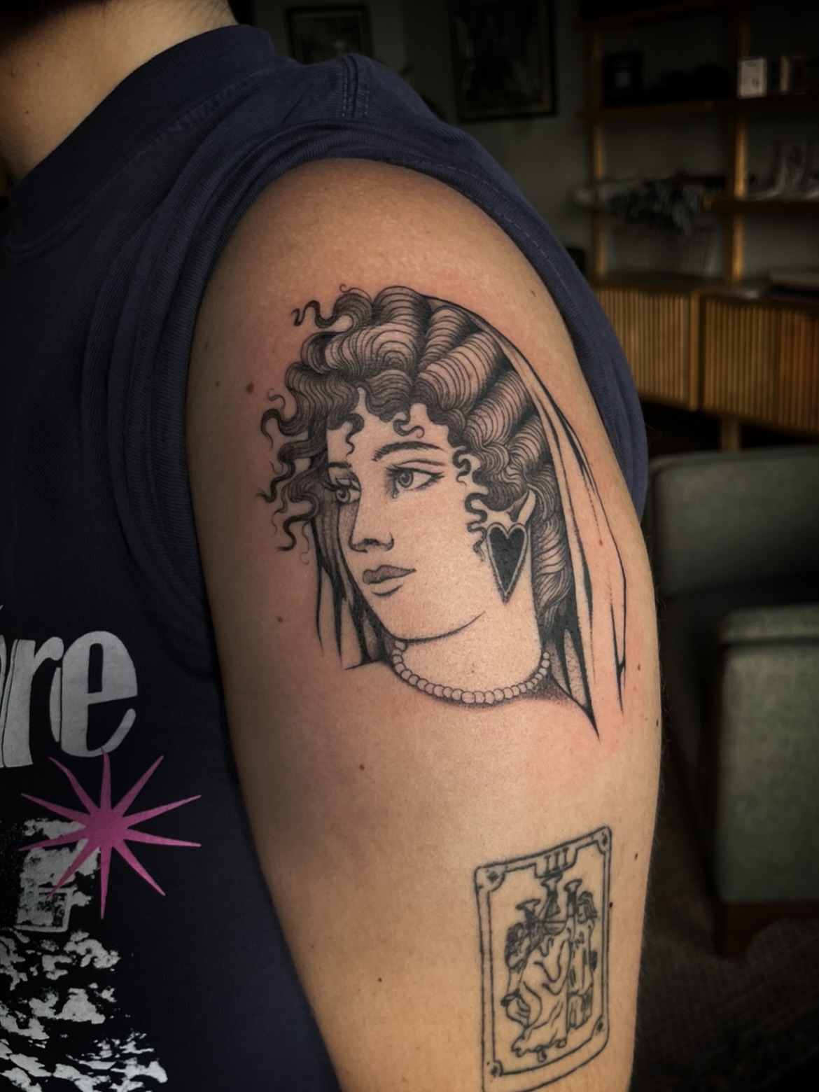 Woman with veil realism tattoo on the shoulder by Eryn, Portland, Oregon