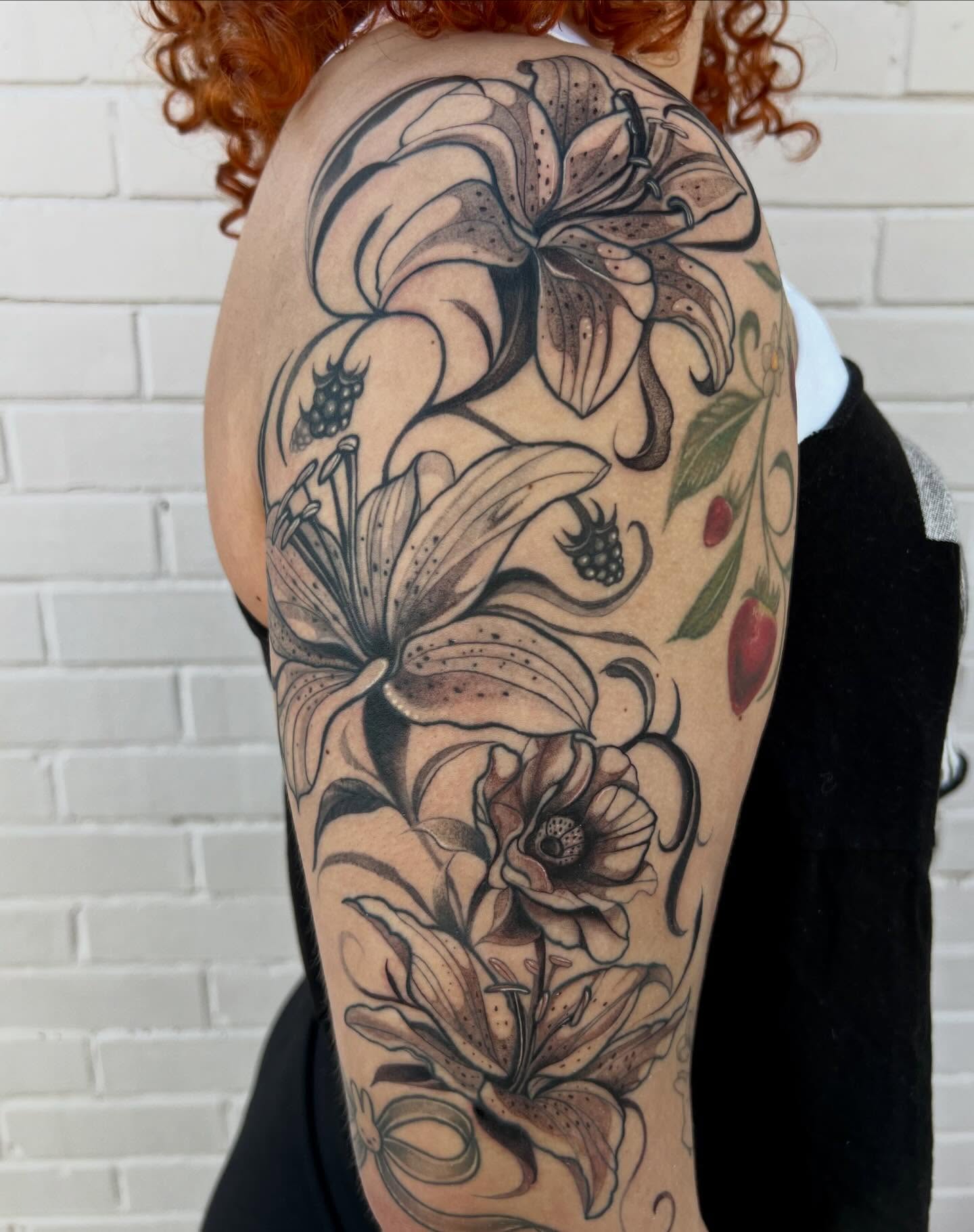 Lilies and berries black and grey tattoo on the upper arm by ✧ :: paloma :: ✧