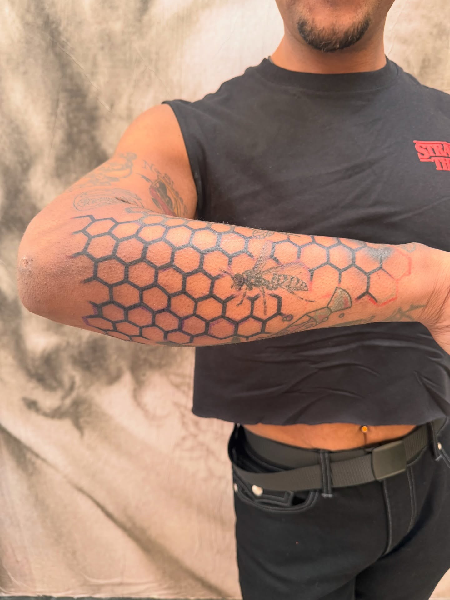 Hexagonal pattern geometric tattoo on the forearm by Sam Padilla