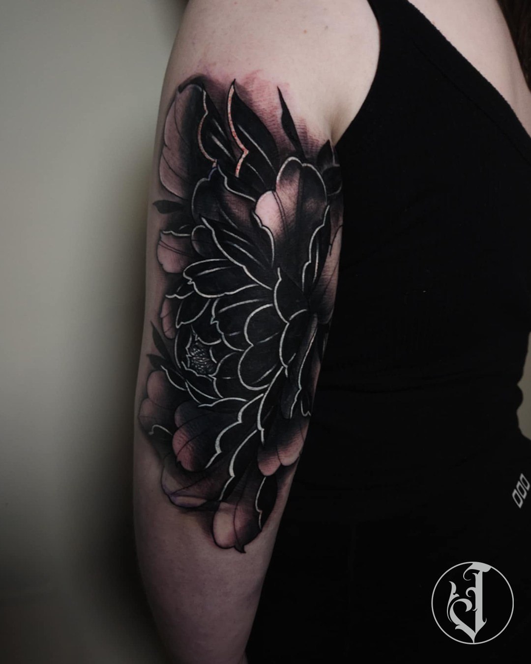 Chrysanthemum black and grey tattoo on the forearm by Tattoos By Josh