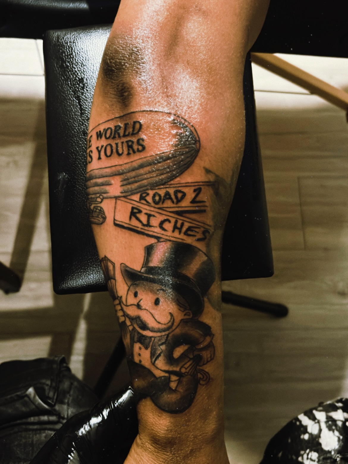 Monopoly man black and grey tattoo on the forearm by Tito Cross ❤️‍🔥