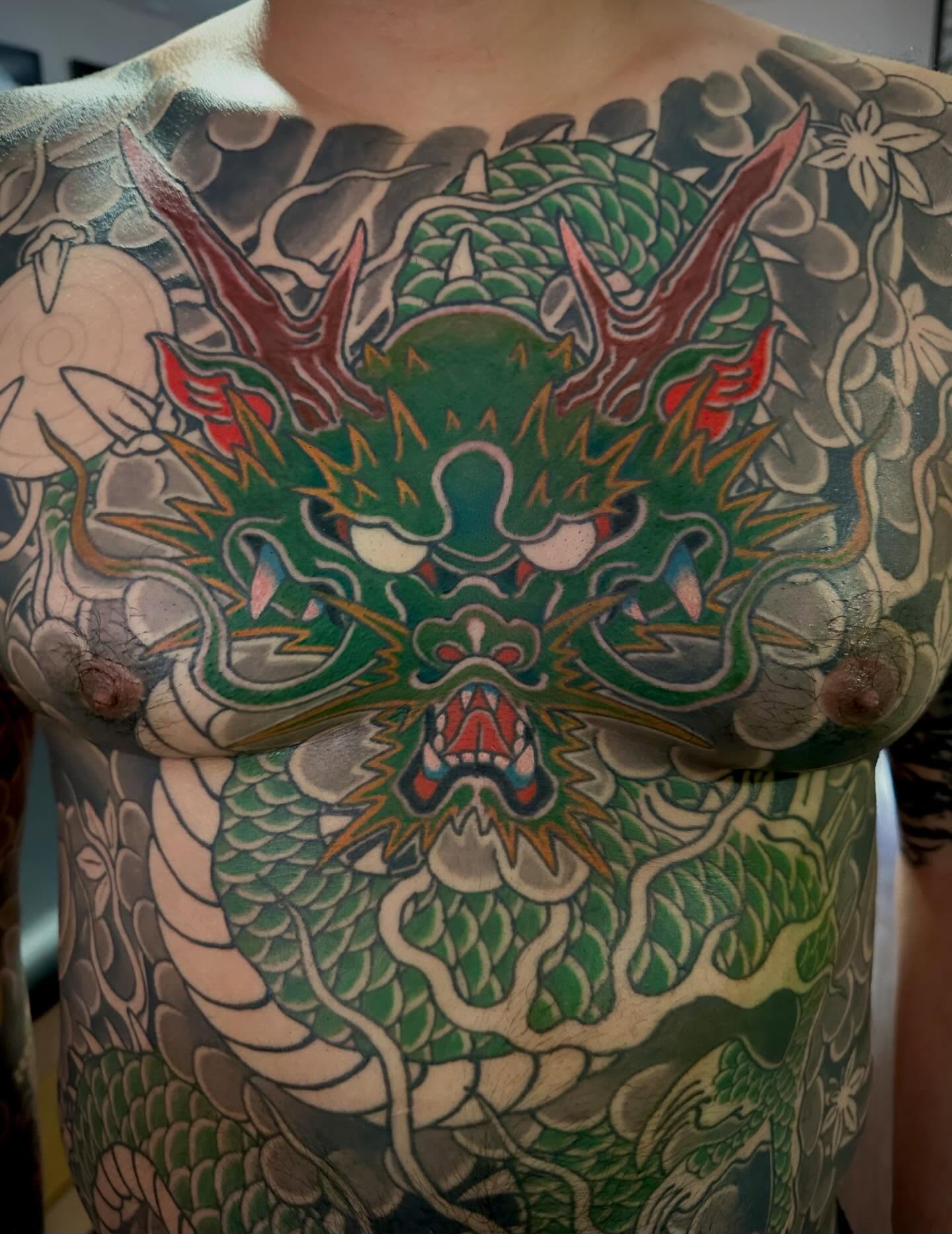 Dragon japanese irezumi tattoo on the chest by Kenny Waizumi ๐