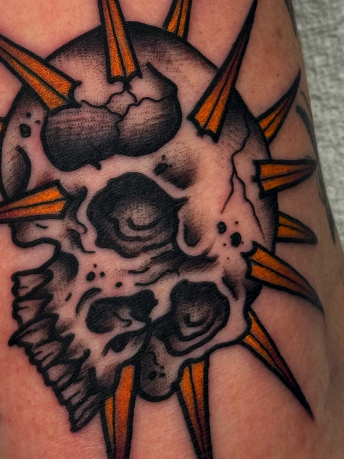 Skull American traditional tattoo on the forearm by Mikey Sarratt