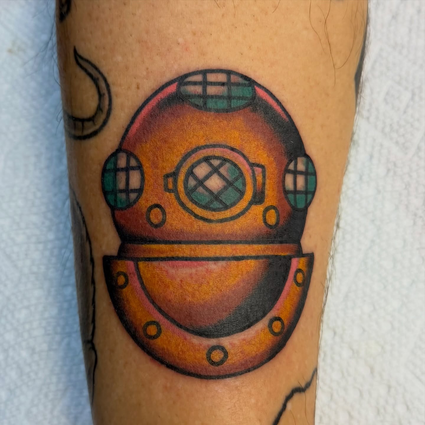 Diving helmet American traditional tattoo on the forearm by Buddy (Holiday) Orr, Las Vegas, Nevada