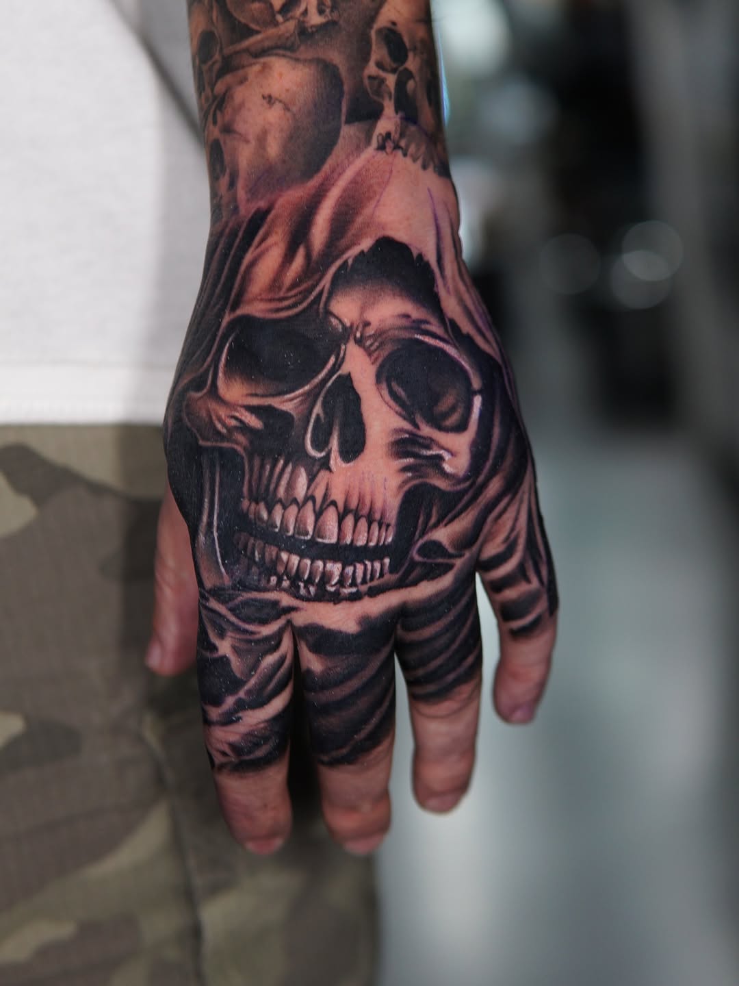 Skull with hood realism tattoo on the hand by Atlanta Tattoo Artist, Atlanta, Georgia