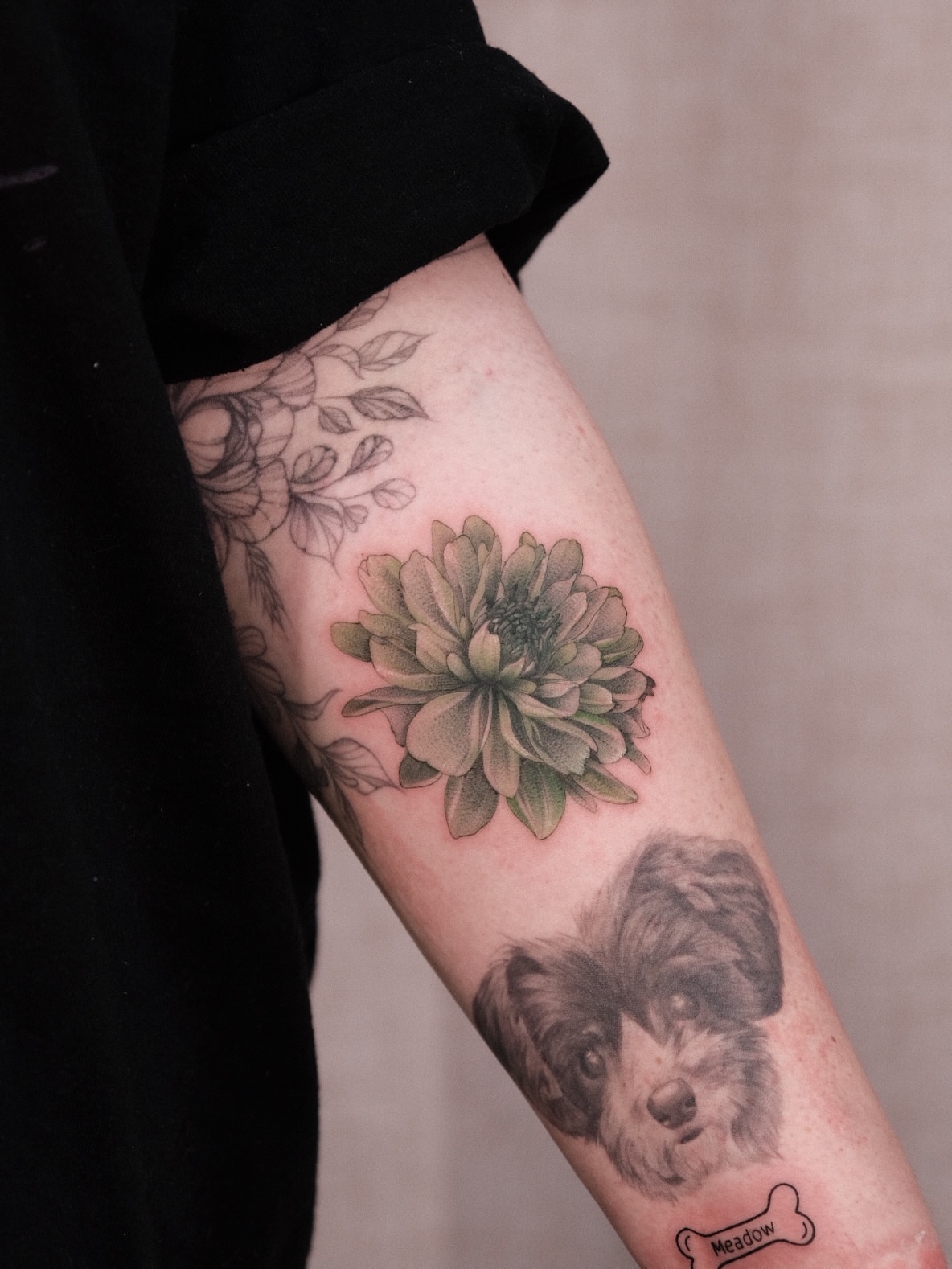 Flower and dog realism tattoo on the forearm by Houston Tattoo Artist GoldenK