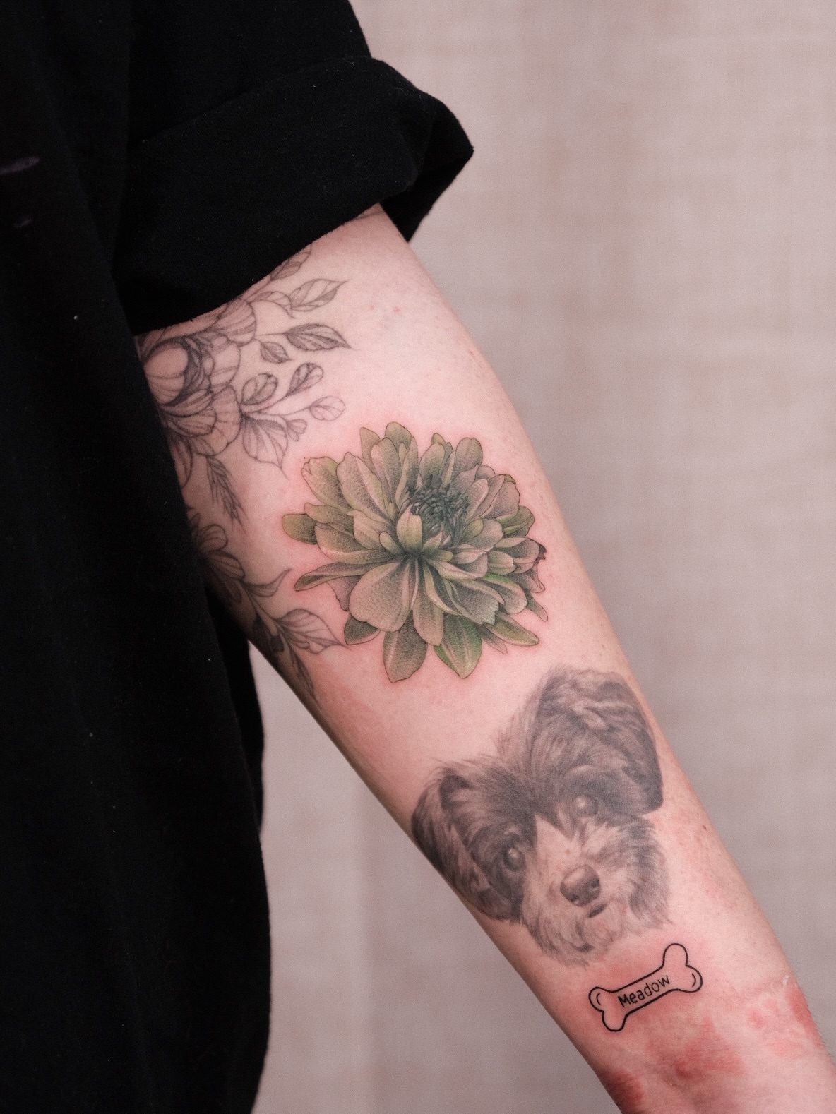 Flower and dog realism tattoo on the forearm by Houston Tattoo Artist GoldenK